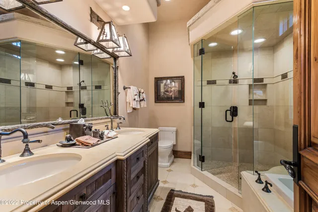 a bedroom with a bed and a couch with window