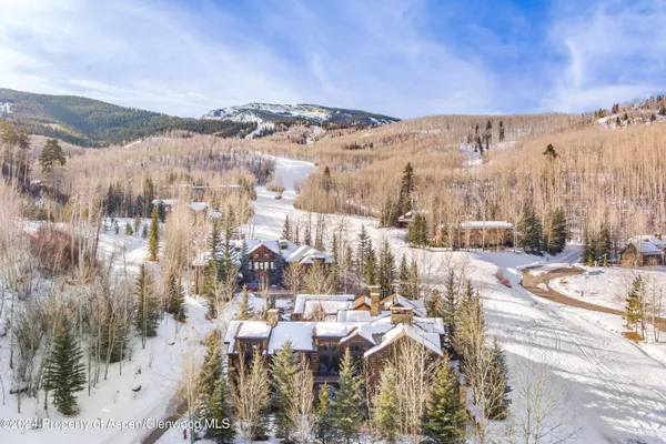 a view of a house with a snow yard and a yard