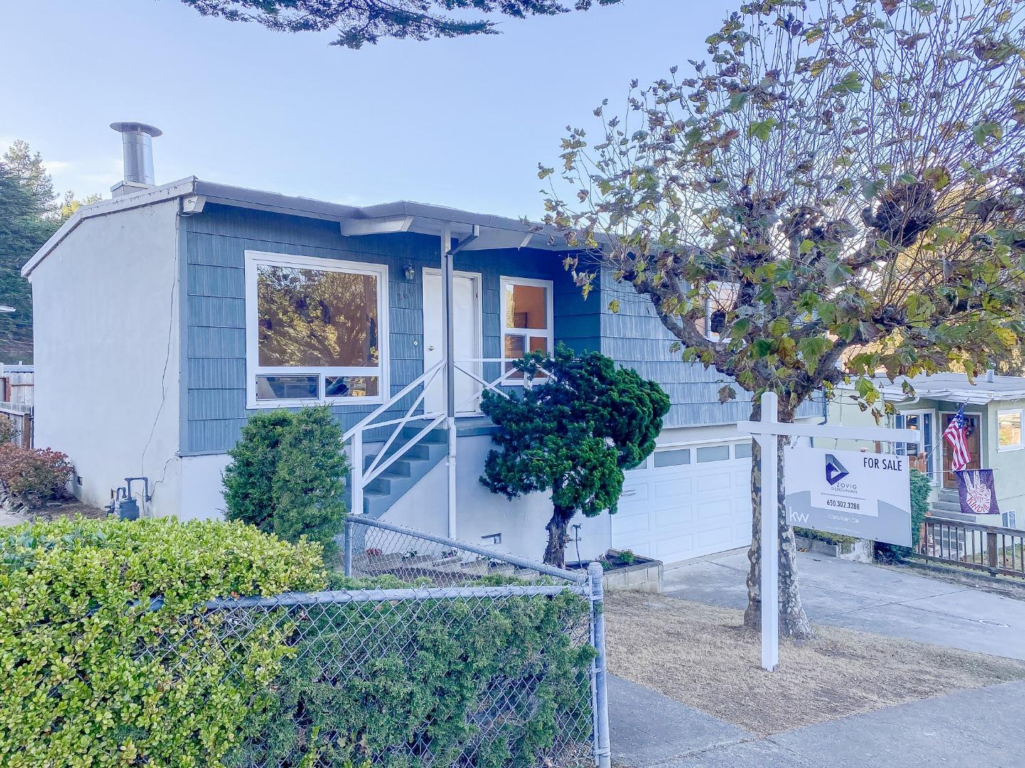 266 Hillside Drive Pacifica, CA 94044 - Photo 1 of 37 a front view of a house with a yard garage and outdoor seating