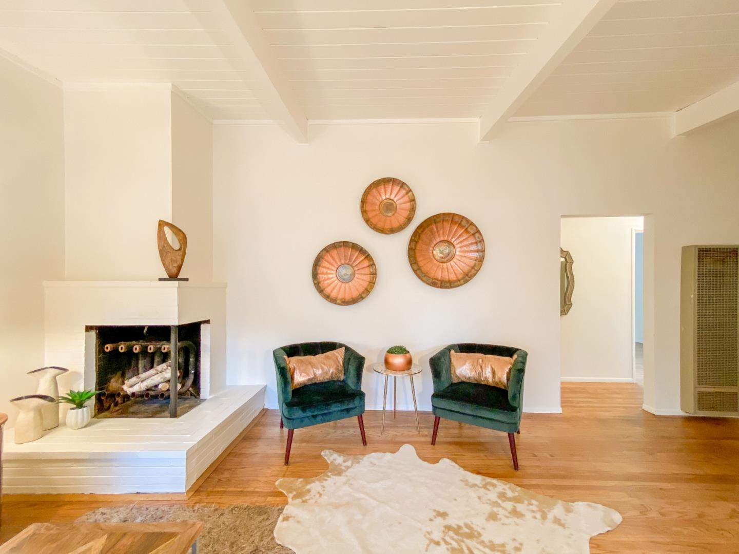 266 Hillside Drive Pacifica, CA 94044 - Photo 12 of 37 a living room with couch a dining table and a fireplace