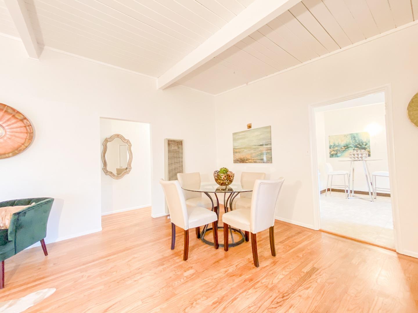 266 Hillside Drive Pacifica, CA 94044 - Photo 14 of 37 a view of a dining room with furniture and wooden floor