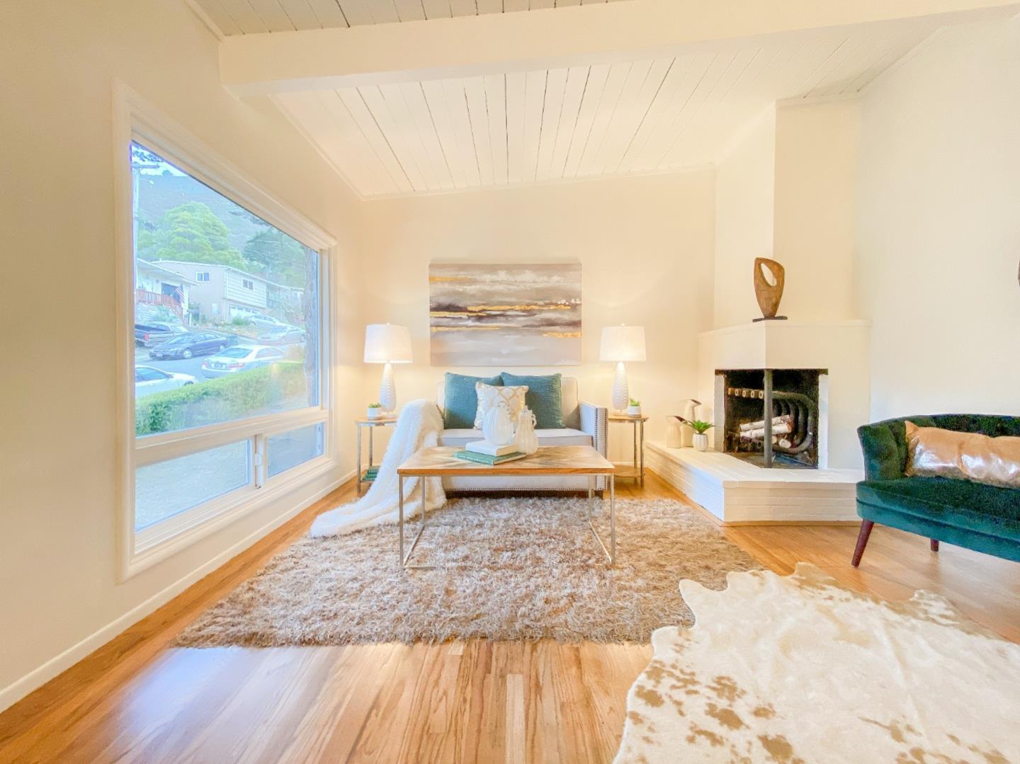 266 Hillside Drive Pacifica, CA 94044 - Photo 16 of 37 a living room with furniture and a fireplace