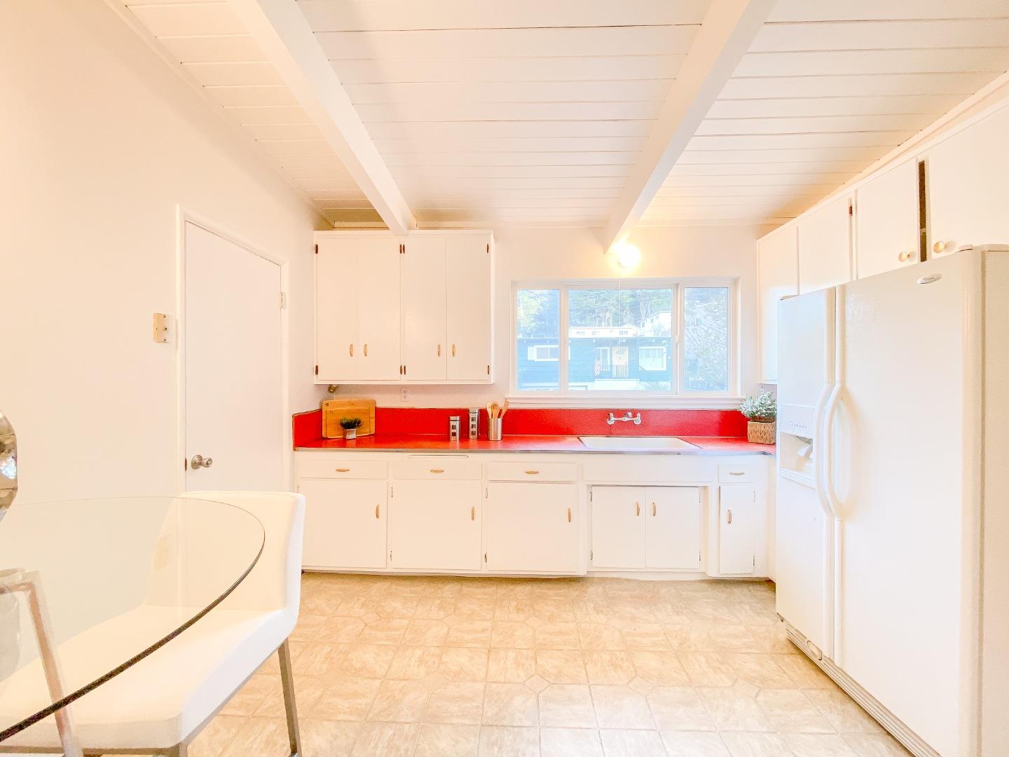 266 Hillside Drive Pacifica, CA 94044 - Photo 17 of 37 a view of kitchen with cabinets and refrigerator