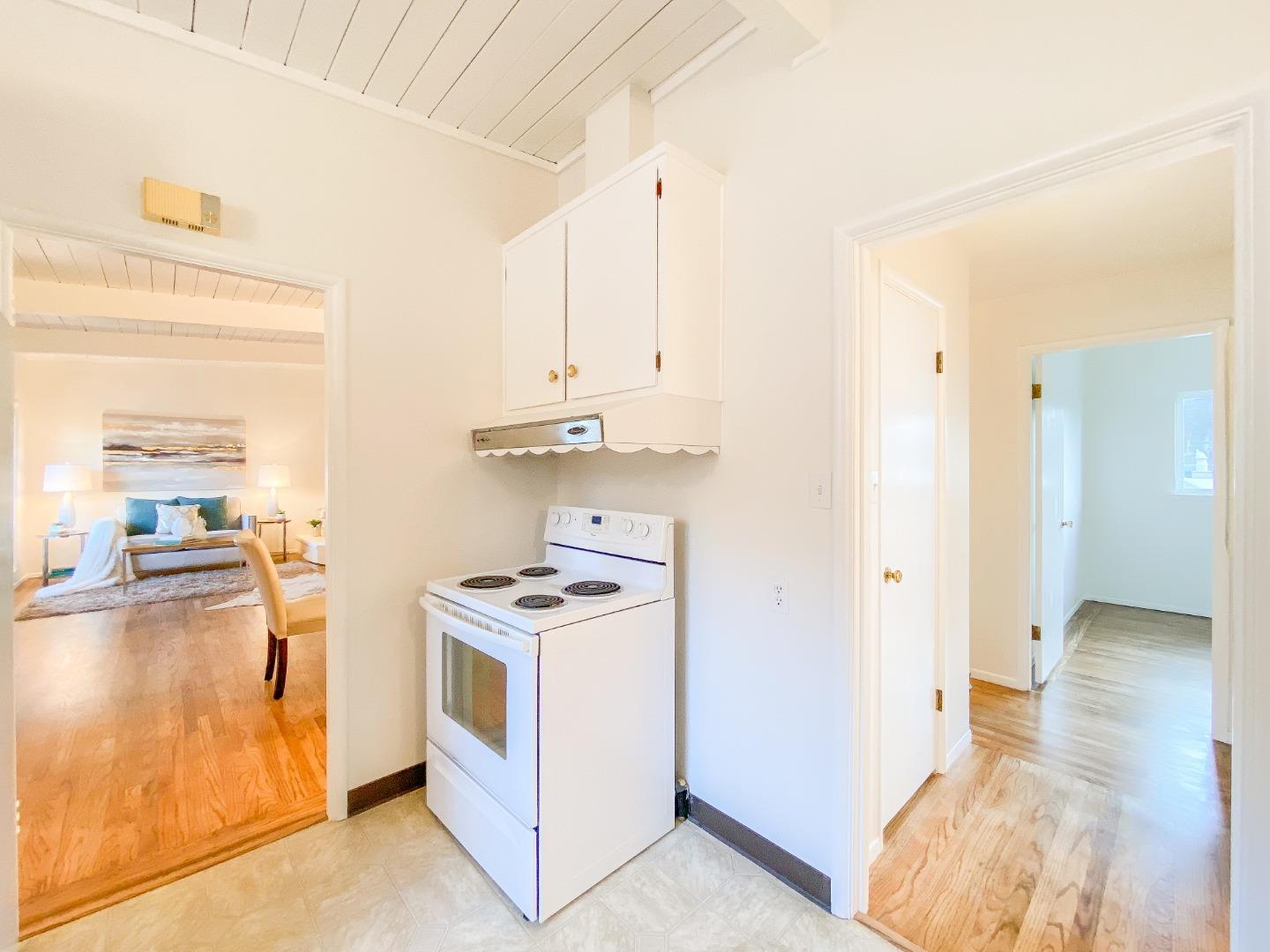 266 Hillside Drive Pacifica, CA 94044 - Photo 20 of 37 a kitchen with stainless steel appliances a stove a refrigerator and cabinets