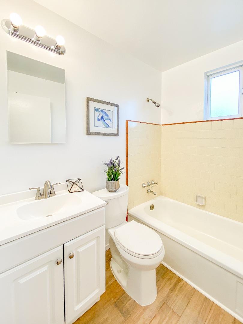 266 Hillside Drive Pacifica, CA 94044 - Photo 22 of 37 a bathroom with a sink a toilet and a bathtub