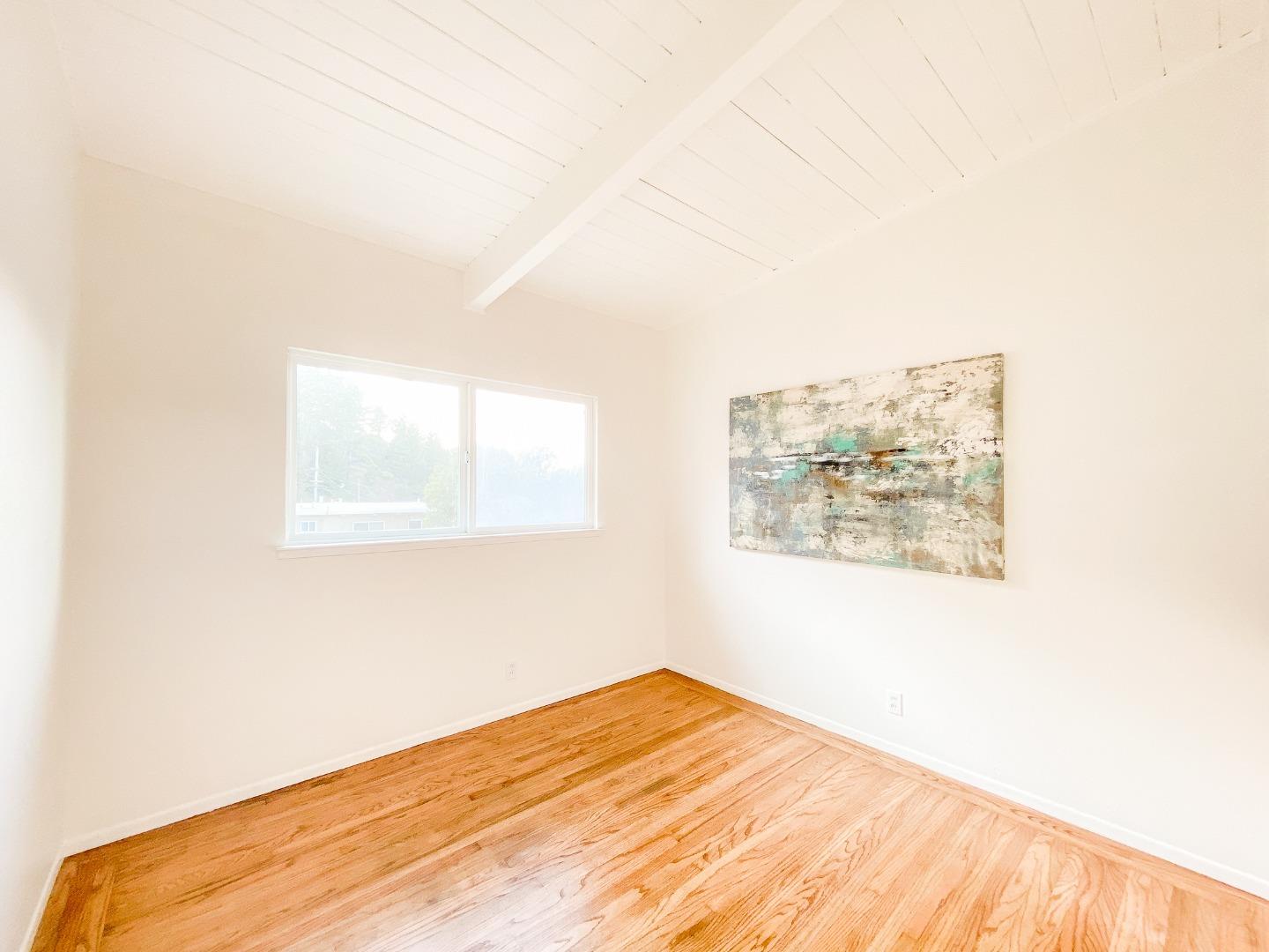 266 Hillside Drive Pacifica, CA 94044 - Photo 24 of 37 a view of a big room with wooden floor and a window