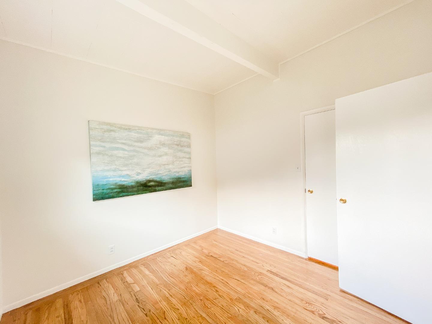266 Hillside Drive Pacifica, CA 94044 - Photo 27 of 37 a view of empty room with wooden floor