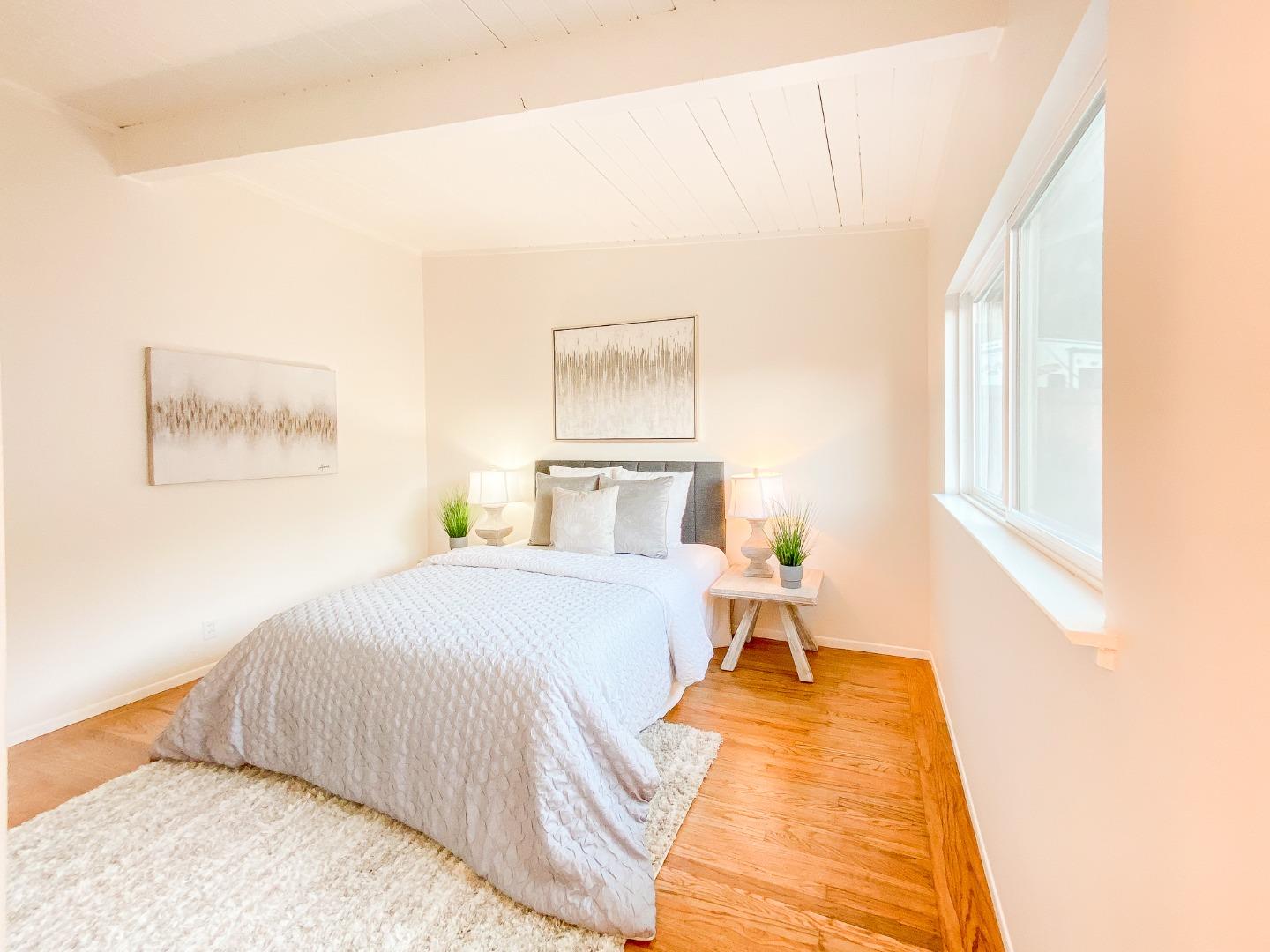 266 Hillside Drive Pacifica, CA 94044 - Photo 29 of 37 a bed room with a bed and a window