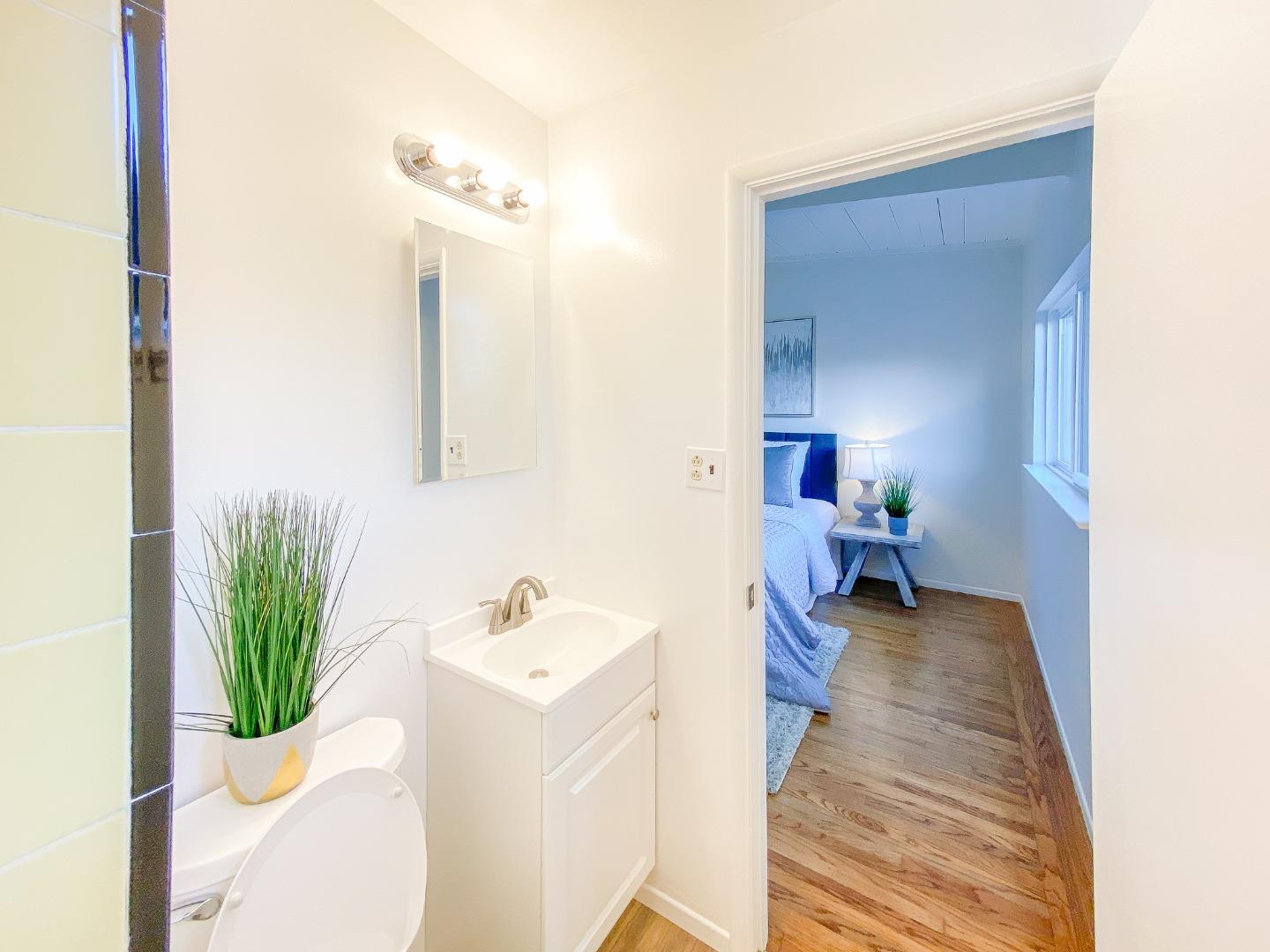 266 Hillside Drive Pacifica, CA 94044 - Photo 30 of 37 a bathroom with a sink and a mirror