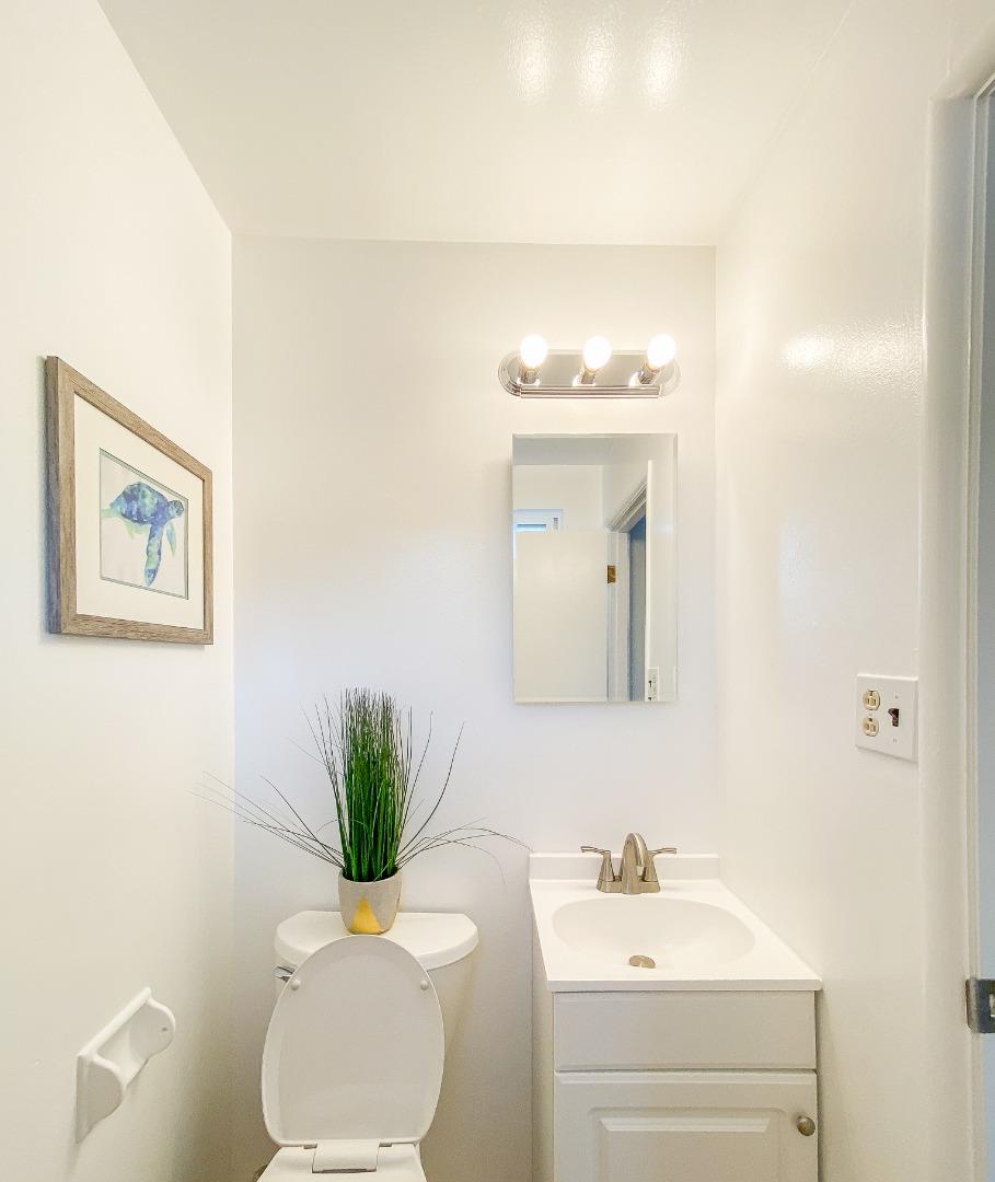 266 Hillside Drive Pacifica, CA 94044 - Photo 33 of 37 a bathroom with a sink a toilet and mirror