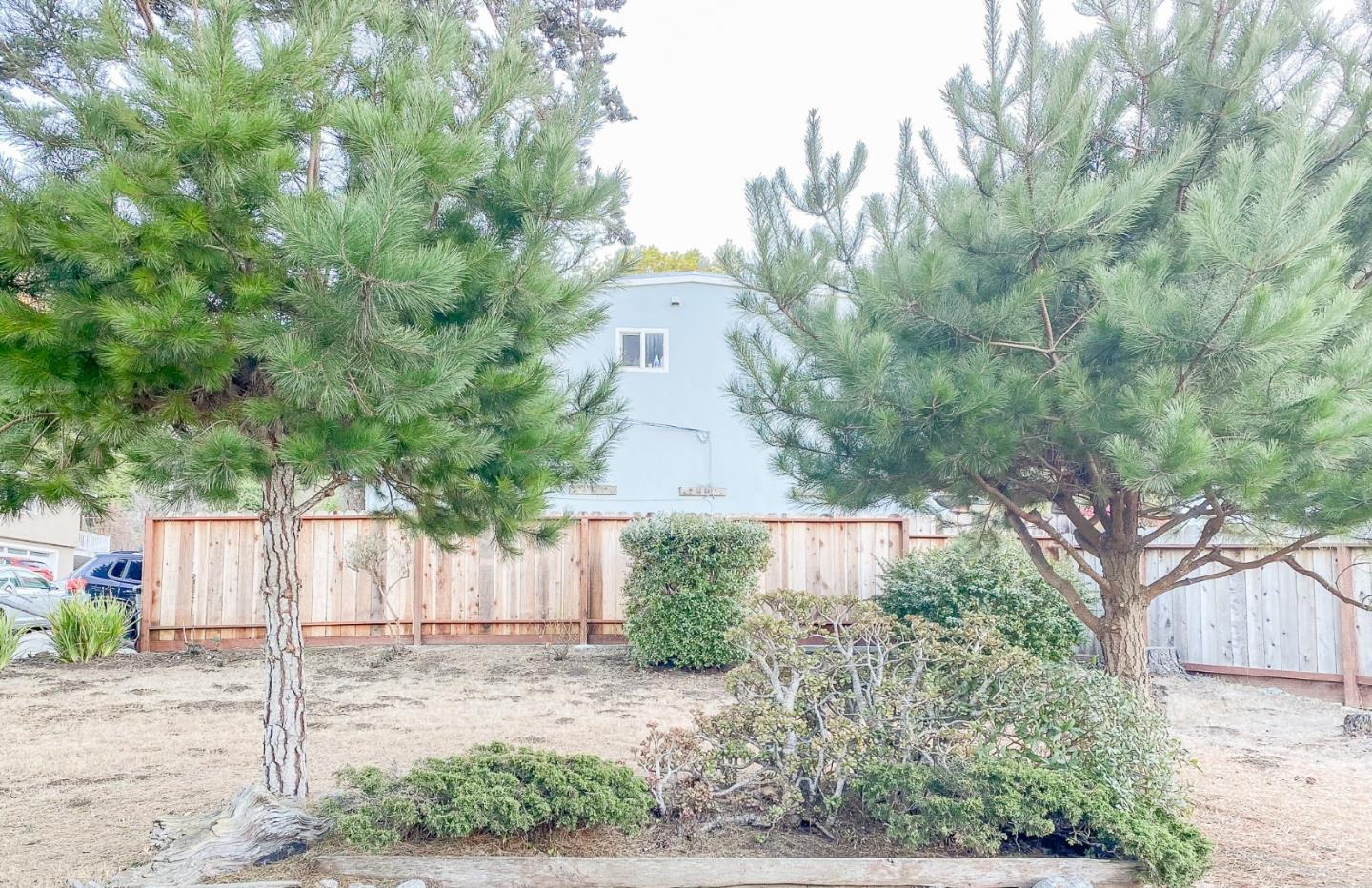 266 Hillside Drive Pacifica, CA 94044 - Photo 37 of 37 a front view of a house with a yard and garage