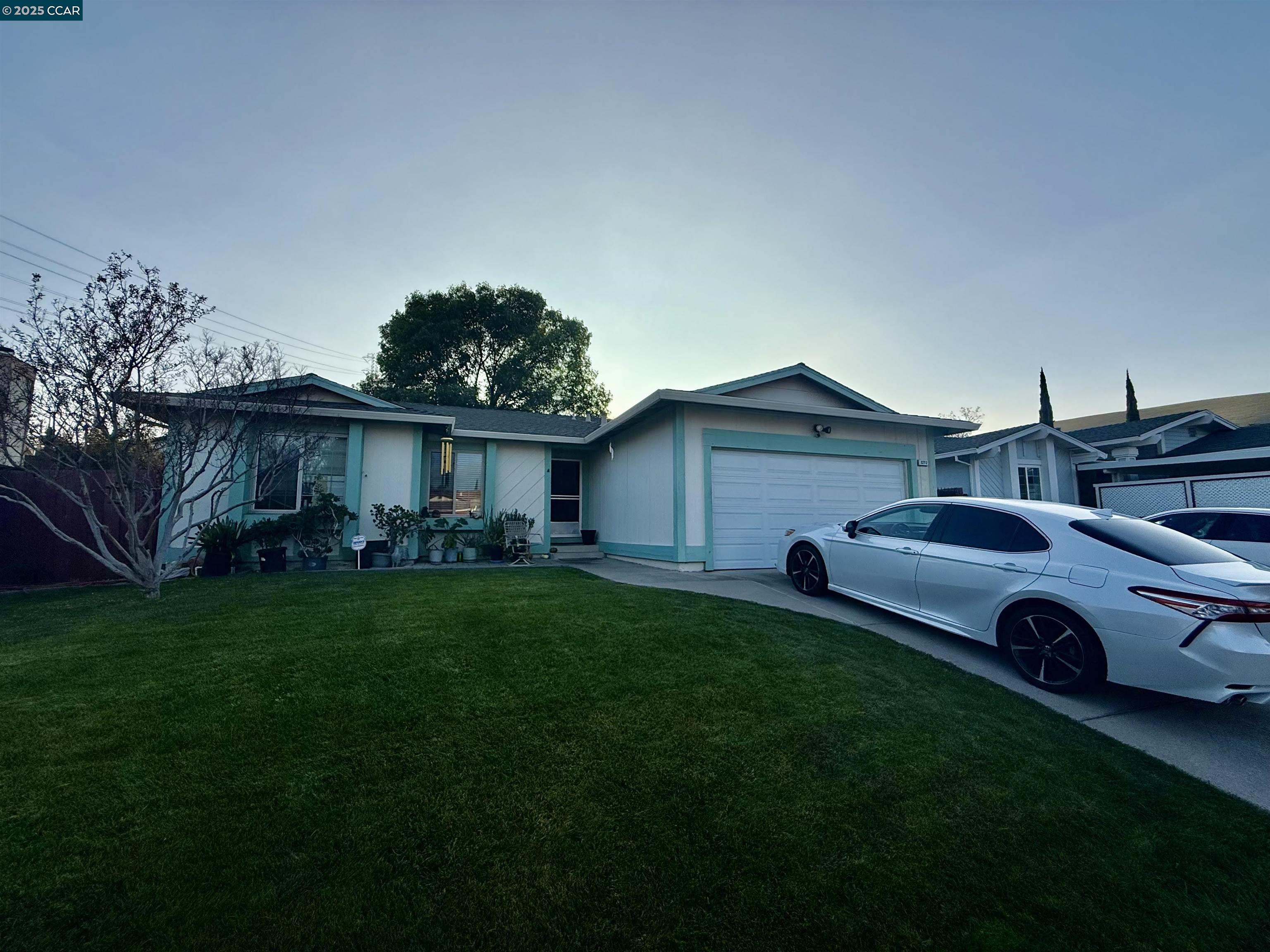 a front view of a house with garden