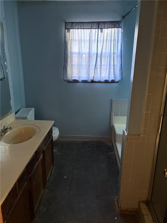 8521 Cedar Creek Ridge Riverdale, GA 30274 - Photo 6 of 9 a bathroom with a sink and a window