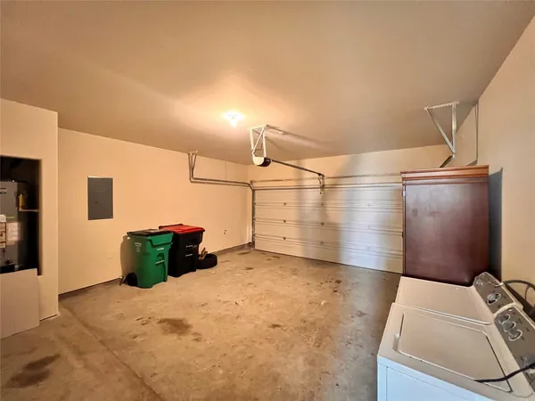 a view of storage and utility room with closet