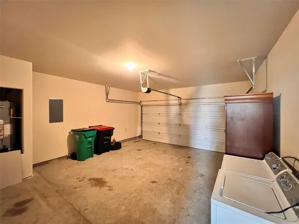 a view of storage and utility room with closet