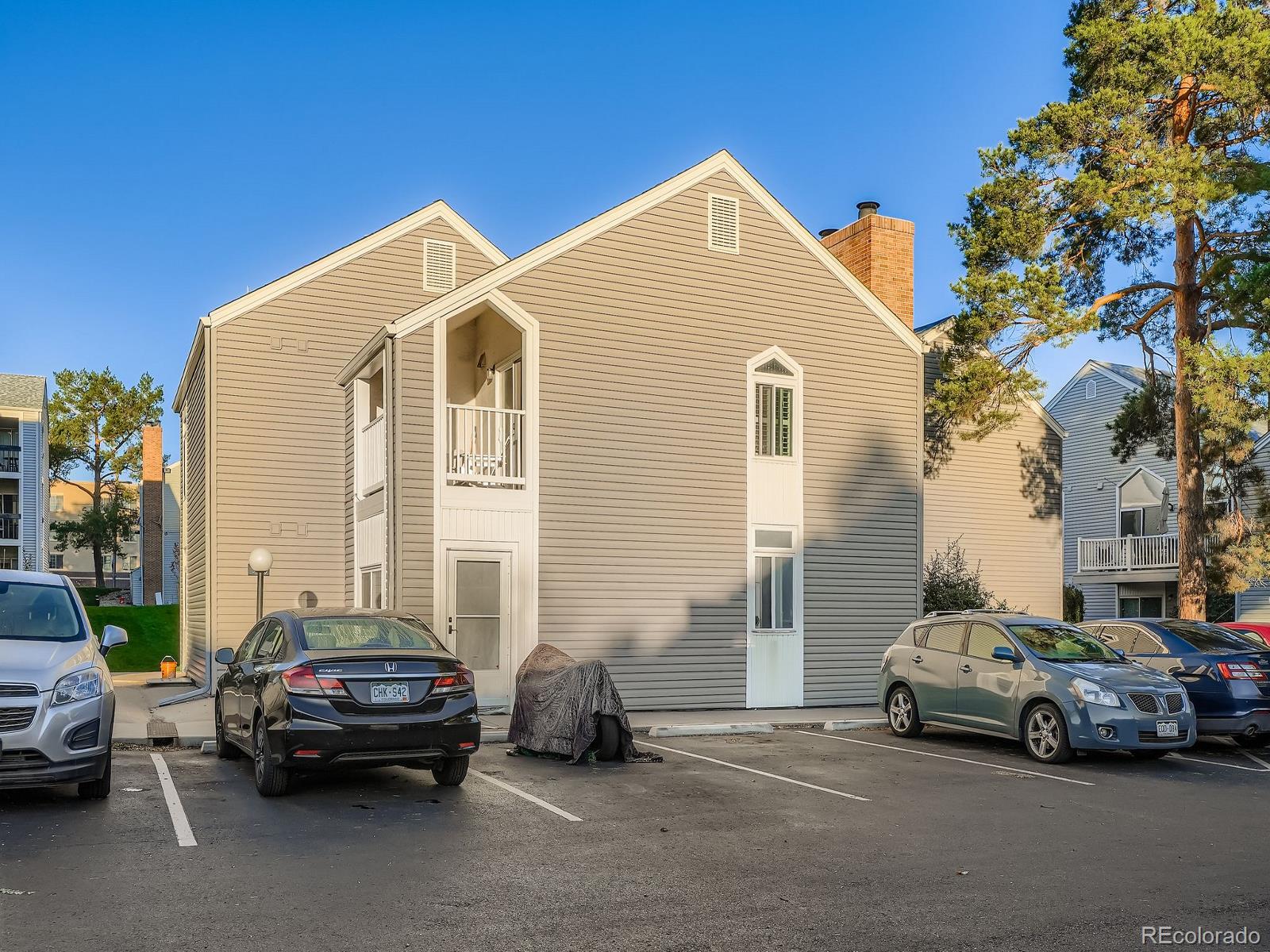 3420 South Locust Street, Unit D Denver, CO 80222 - Photo 15 of 16 a car parked in front of a house