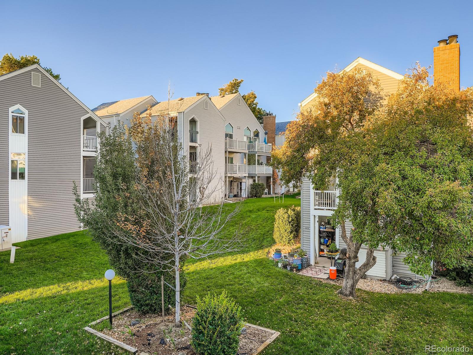 3420 South Locust Street, Unit D Denver, CO 80222 - Photo 16 of 16 a view of a house with a yard
