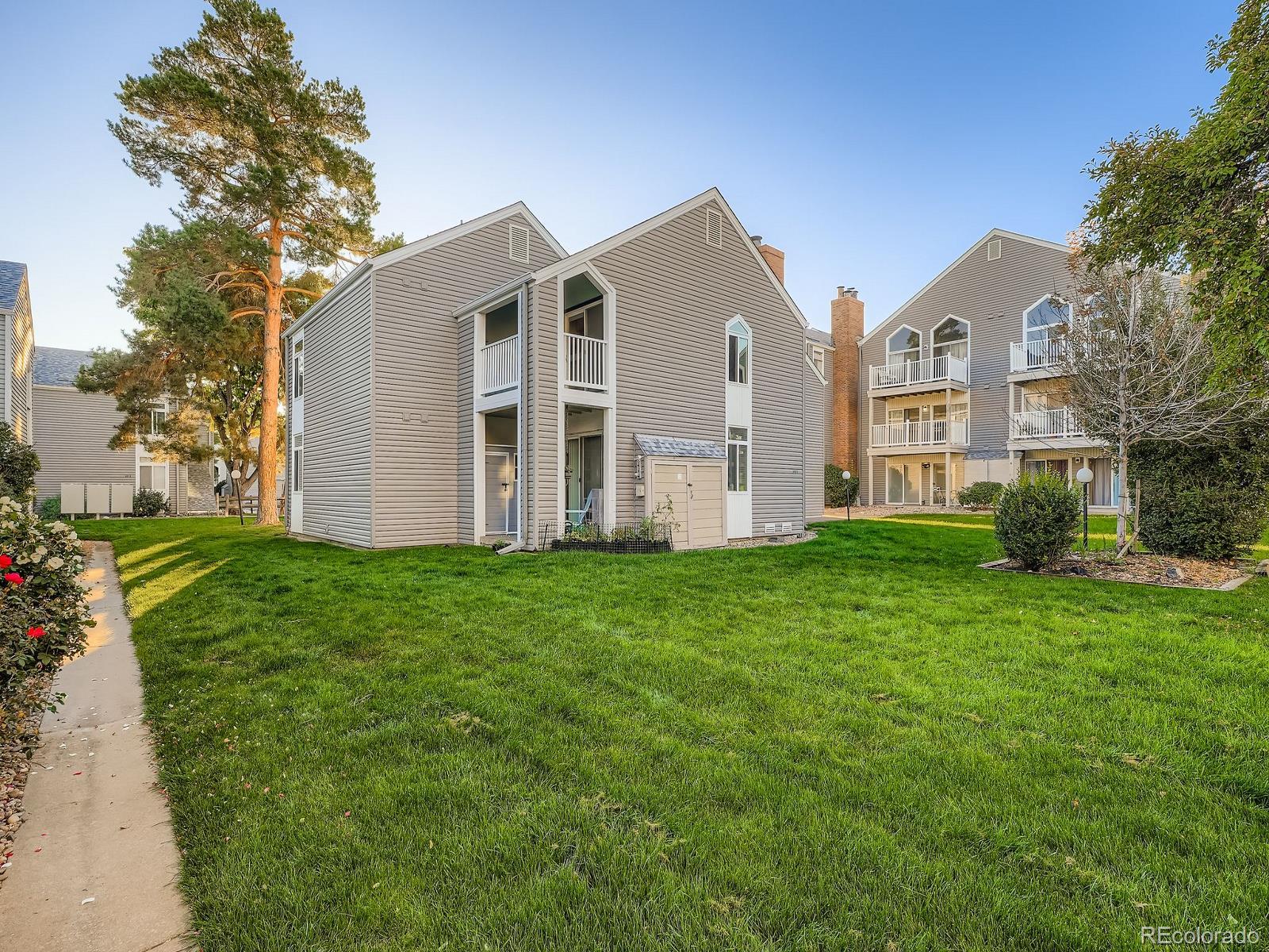 3420 South Locust Street, Unit D Denver, CO 80222 - Photo 2 of 16 a view of a house with backyard and garden