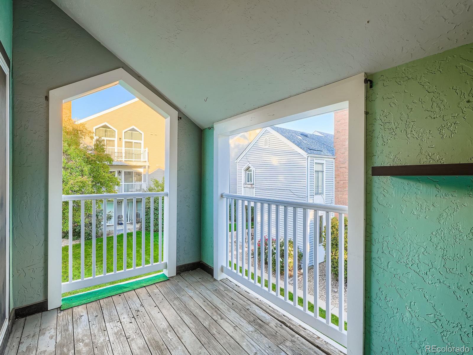 3420 South Locust Street, Unit D Denver, CO 80222 - Photo 8 of 16 a view of a room with balcony and furniture