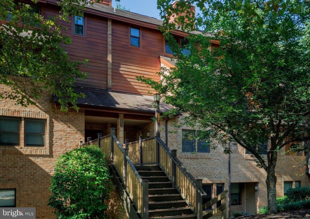 a front view of a house with stairs
