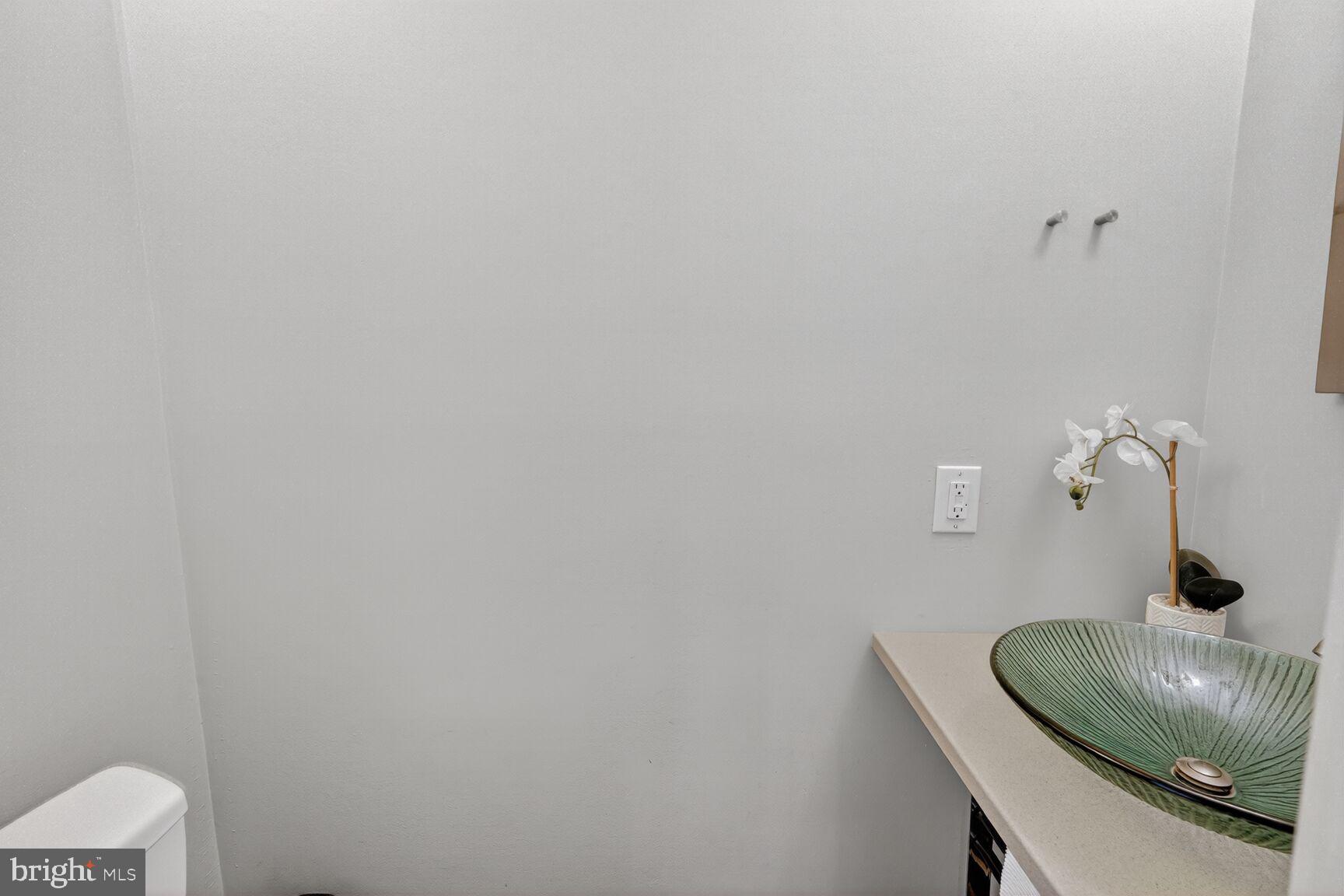 7505 Weather Worn Way, Unit E Columbia, MD 21046 - Photo 12 of 32 a bathroom with a sink and toilet