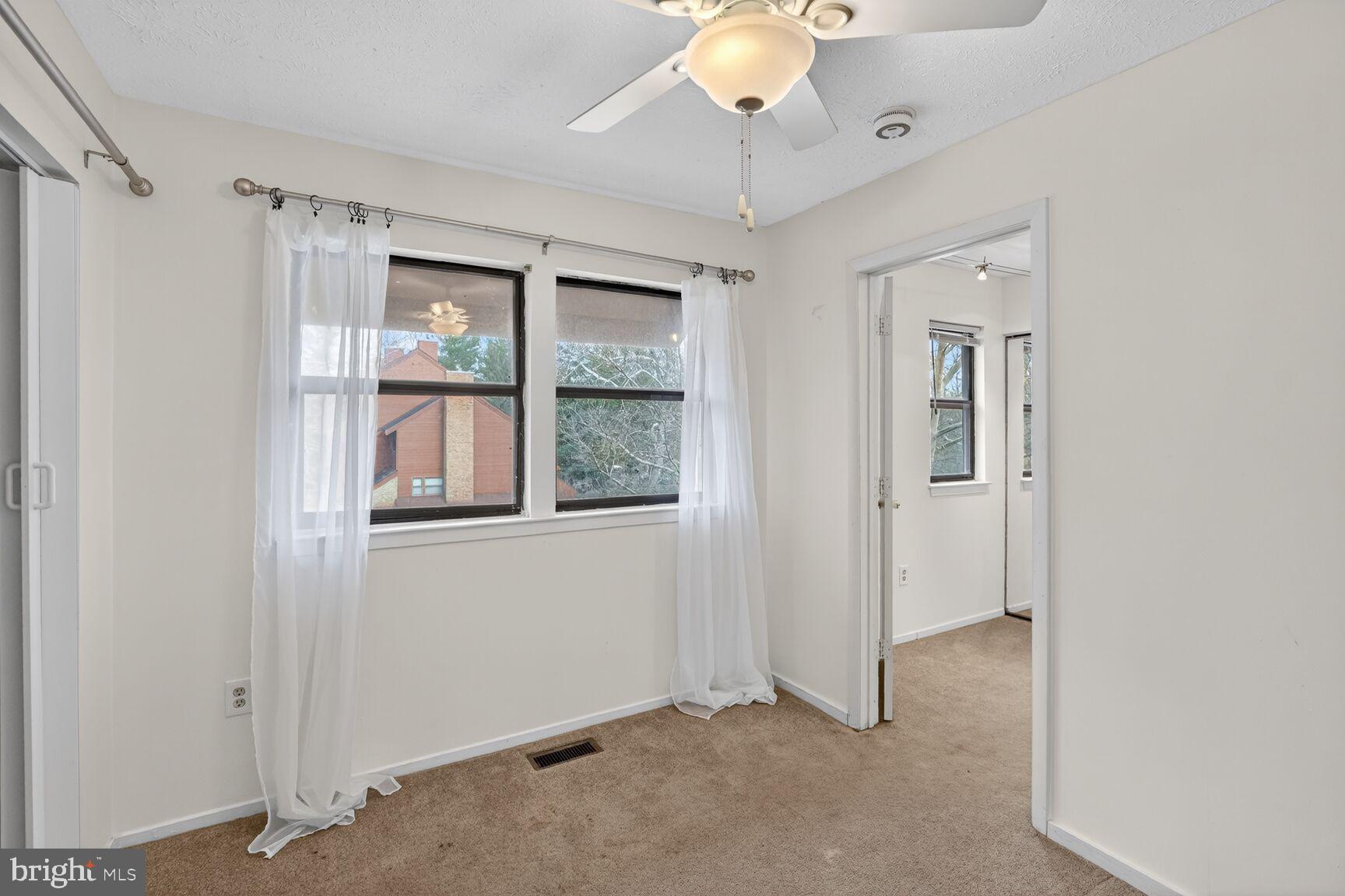 7505 Weather Worn Way, Unit E Columbia, MD 21046 - Photo 17 of 32 a view of an empty room with a window