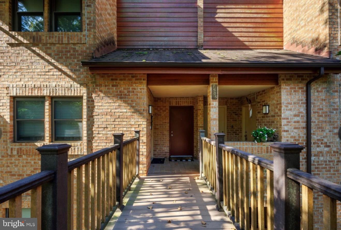 7505 Weather Worn Way, Unit E Columbia, MD 21046 - Photo 2 of 32 a view of a house with wooden fence