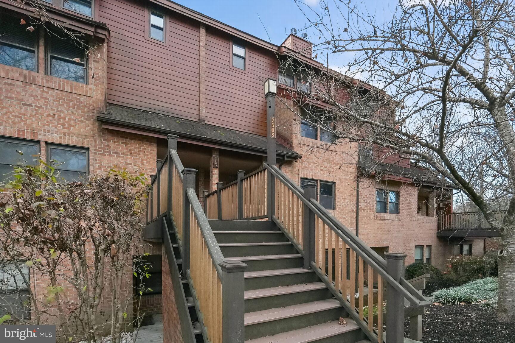 7505 Weather Worn Way, Unit E Columbia, MD 21046 - Photo 31 of 32 a view of a house with wooden fence and two windows