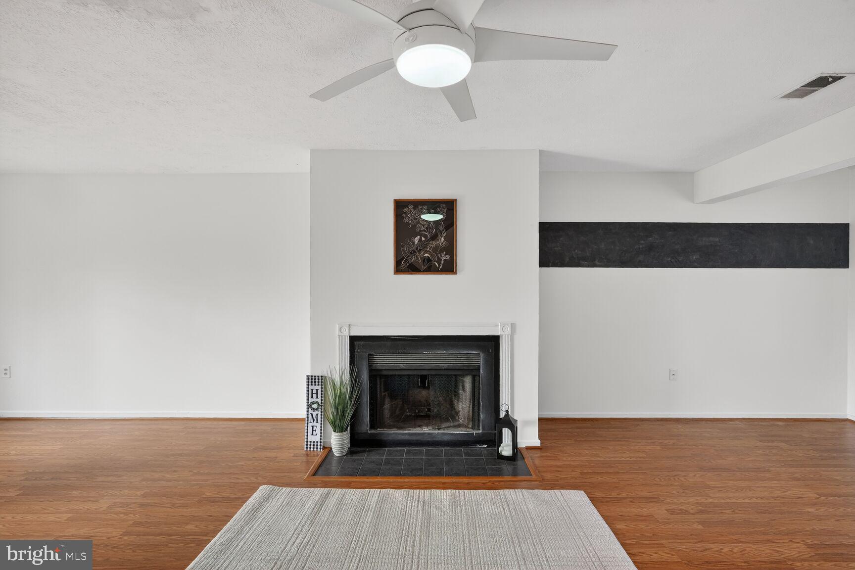 7505 Weather Worn Way, Unit E Columbia, MD 21046 - Photo 6 of 32 a view of a livingroom with a fireplace and window