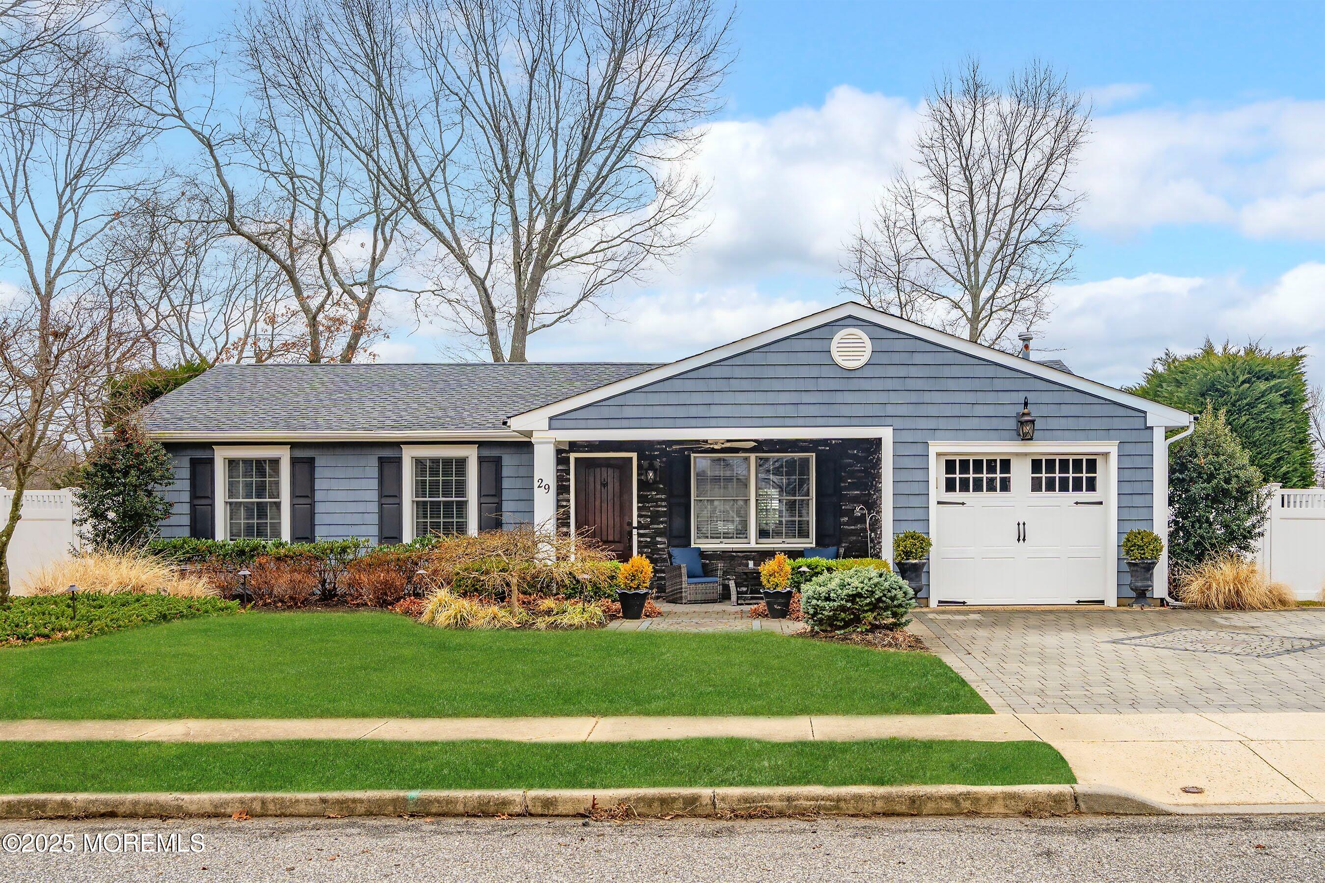 a front view of a house with garden