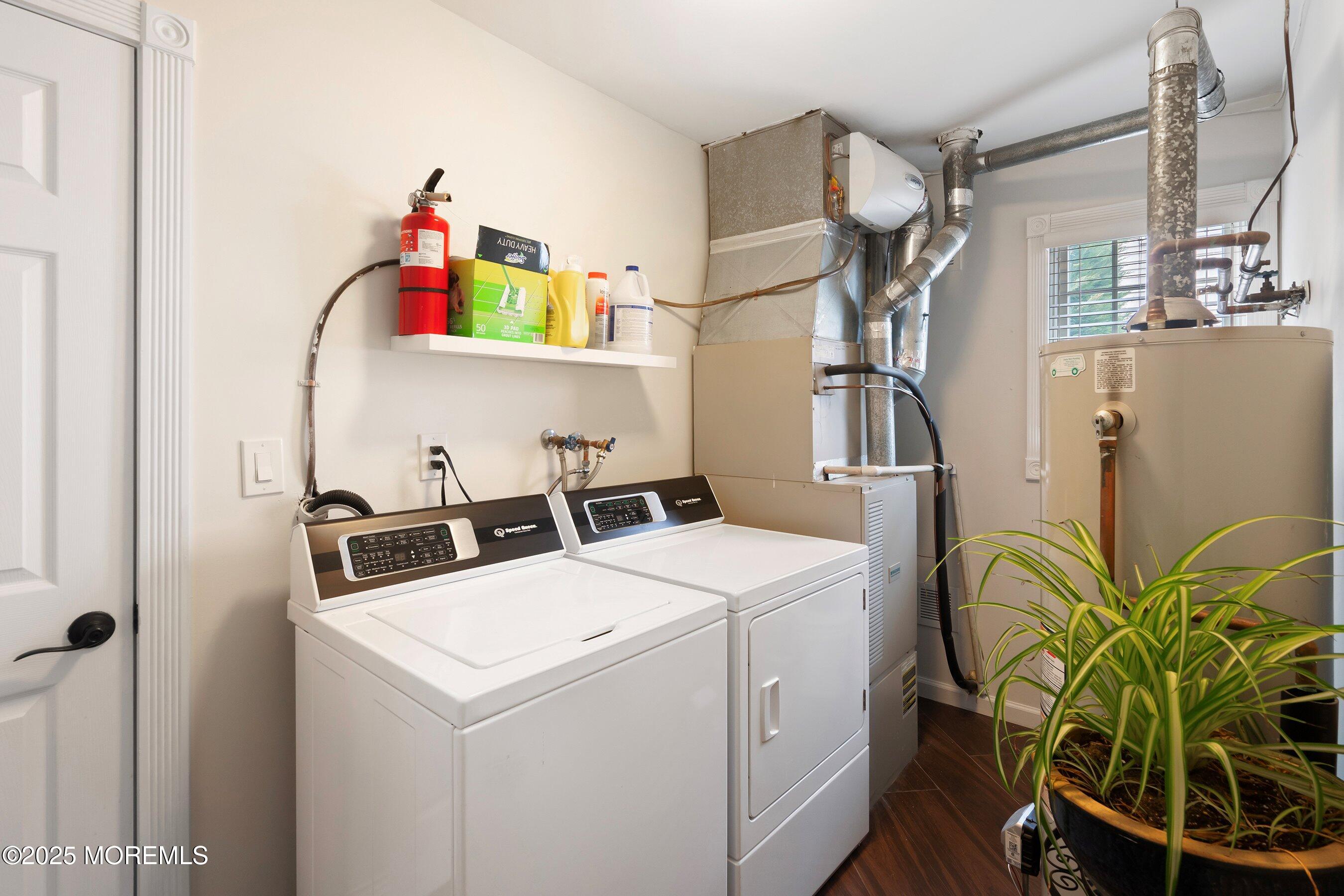 29 Pine Needle Street Howell, NJ 07731 - Photo 12 of 26 a utility room with dryer and washer