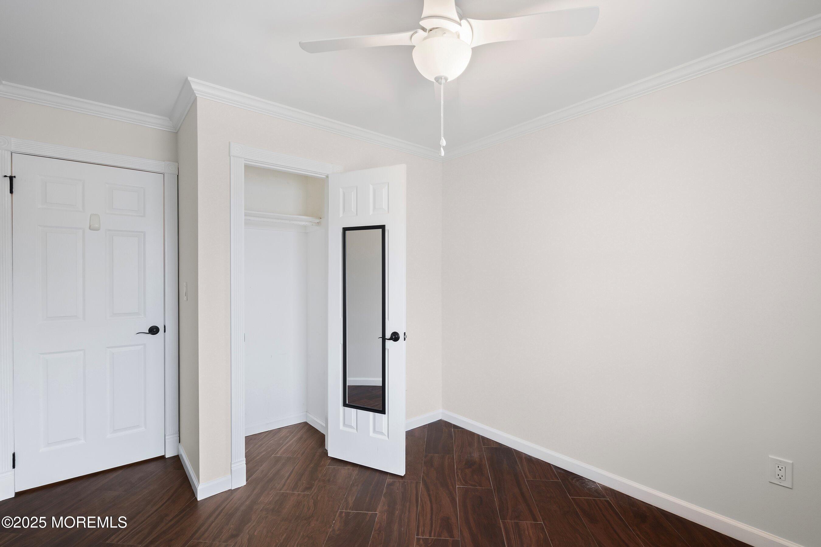 29 Pine Needle Street Howell, NJ 07731 - Photo 13 of 26 a view of an empty room with wooden floor