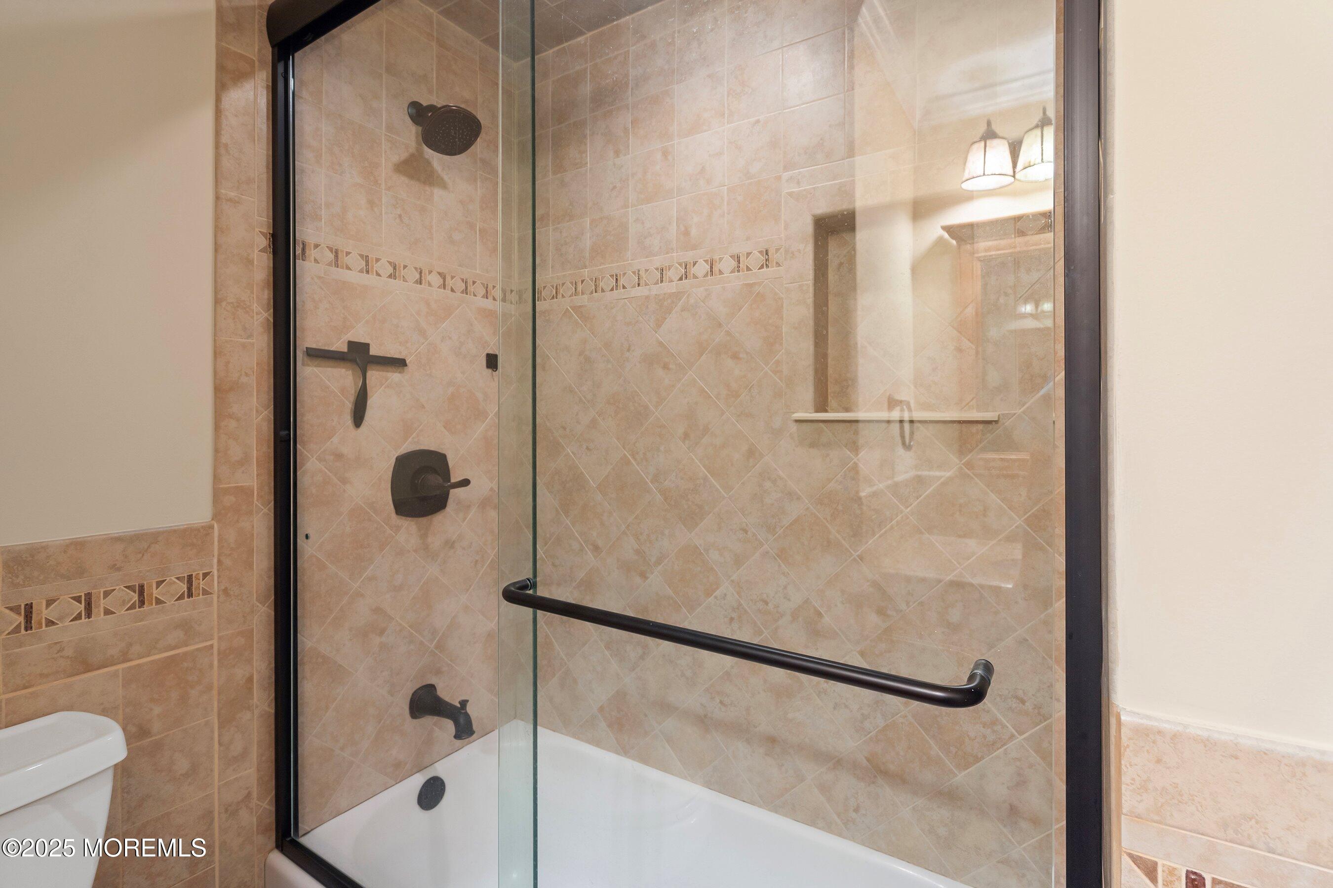 29 Pine Needle Street Howell, NJ 07731 - Photo 15 of 26 a bathroom with a shower