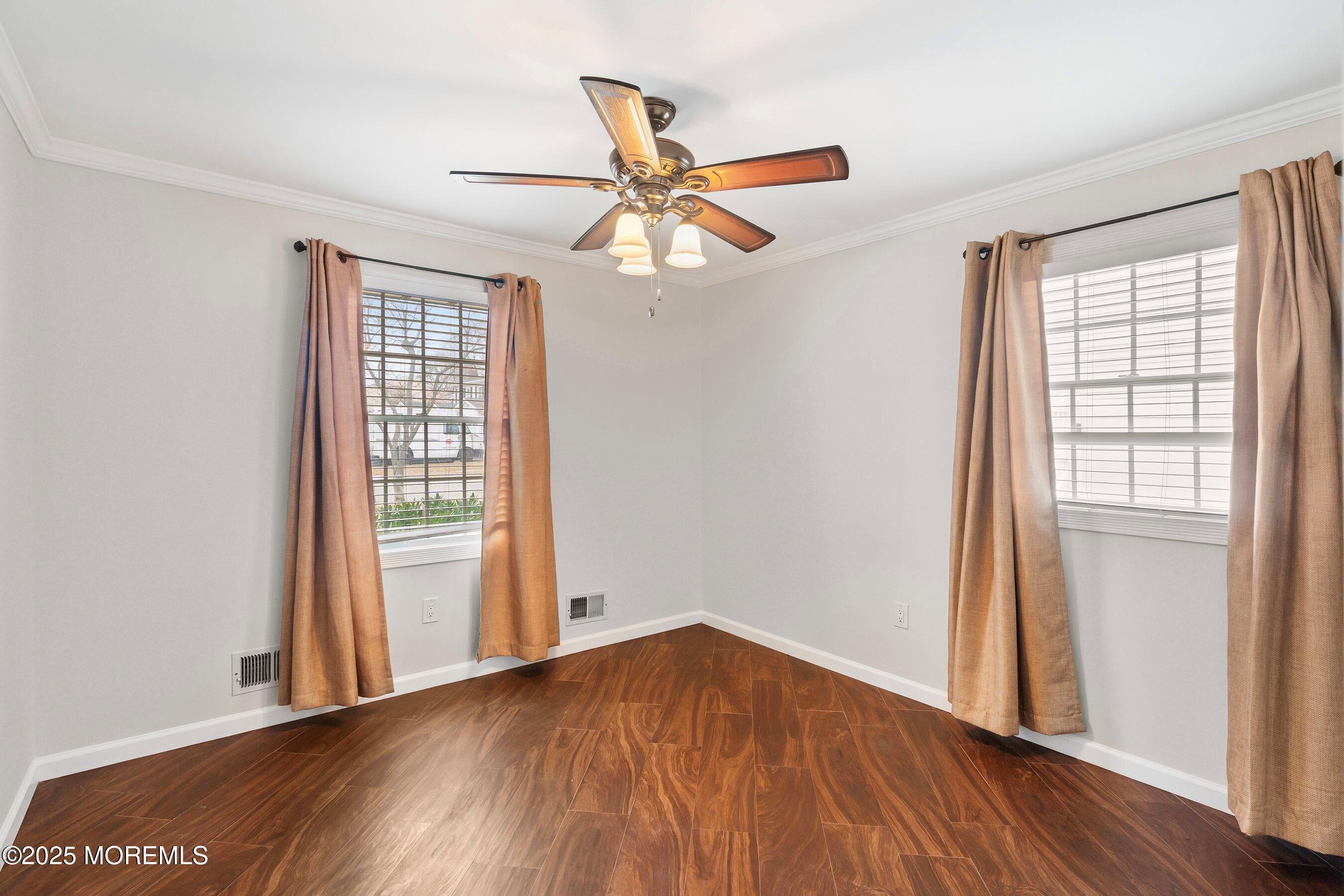 29 Pine Needle Street Howell, NJ 07731 - Photo 17 of 26 an empty room with wooden floor closet and windows