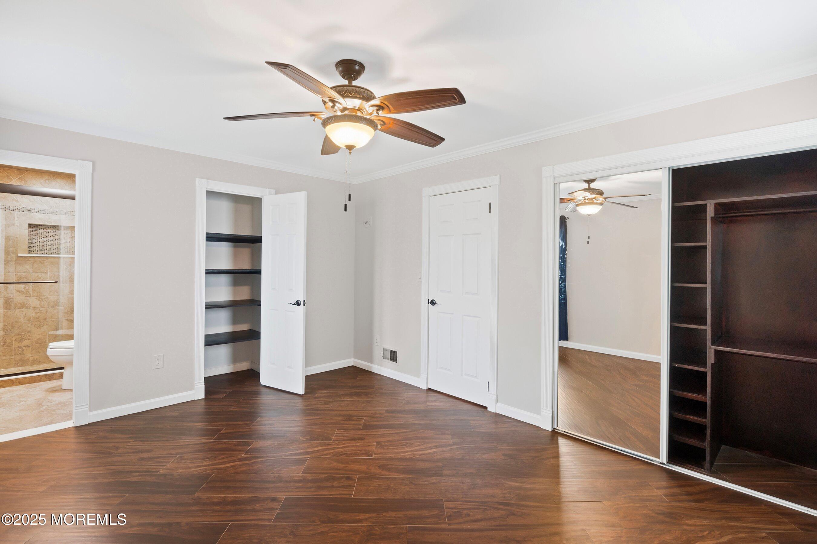 29 Pine Needle Street Howell, NJ 07731 - Photo 19 of 26 an empty room with wooden floor closet and windows