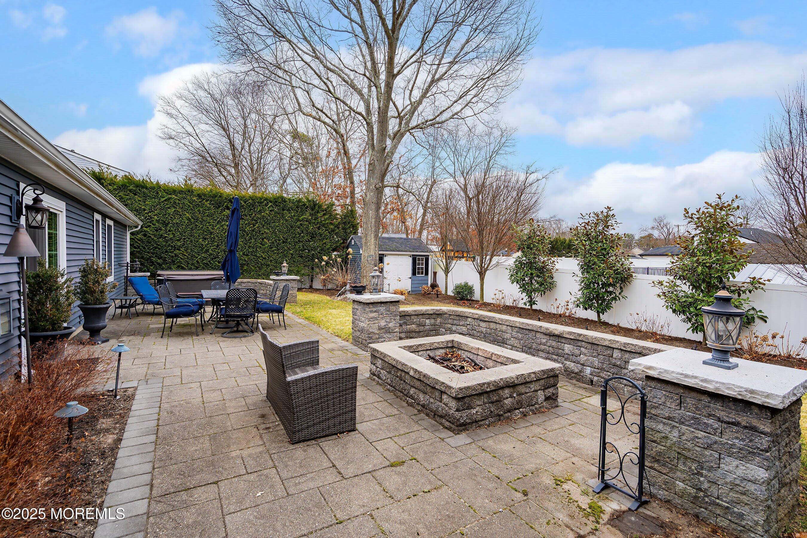 29 Pine Needle Street Howell, NJ 07731 - Photo 23 of 26 a view of a patio with swimming pool table and chairs