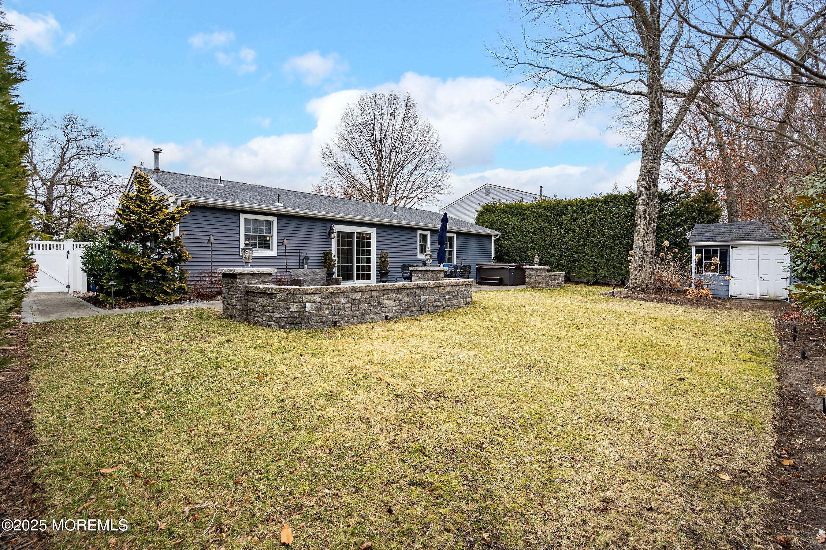 29 Pine Needle Street Howell, NJ 07731 - Photo 26 of 26 a house view with swimming pool and trees in front of it