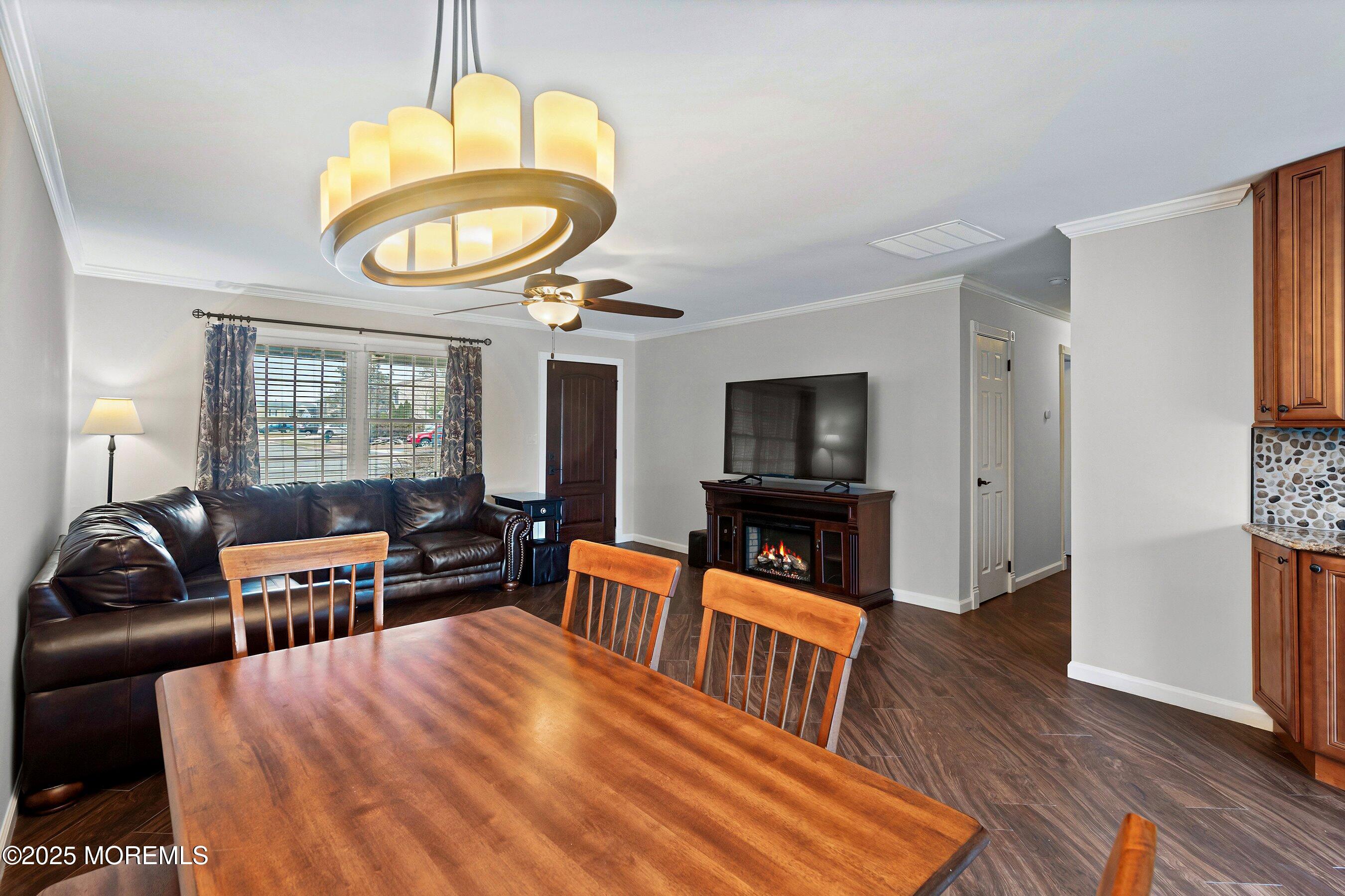 29 Pine Needle Street Howell, NJ 07731 - Photo 5 of 26 a living room with furniture a flat screen tv and a window