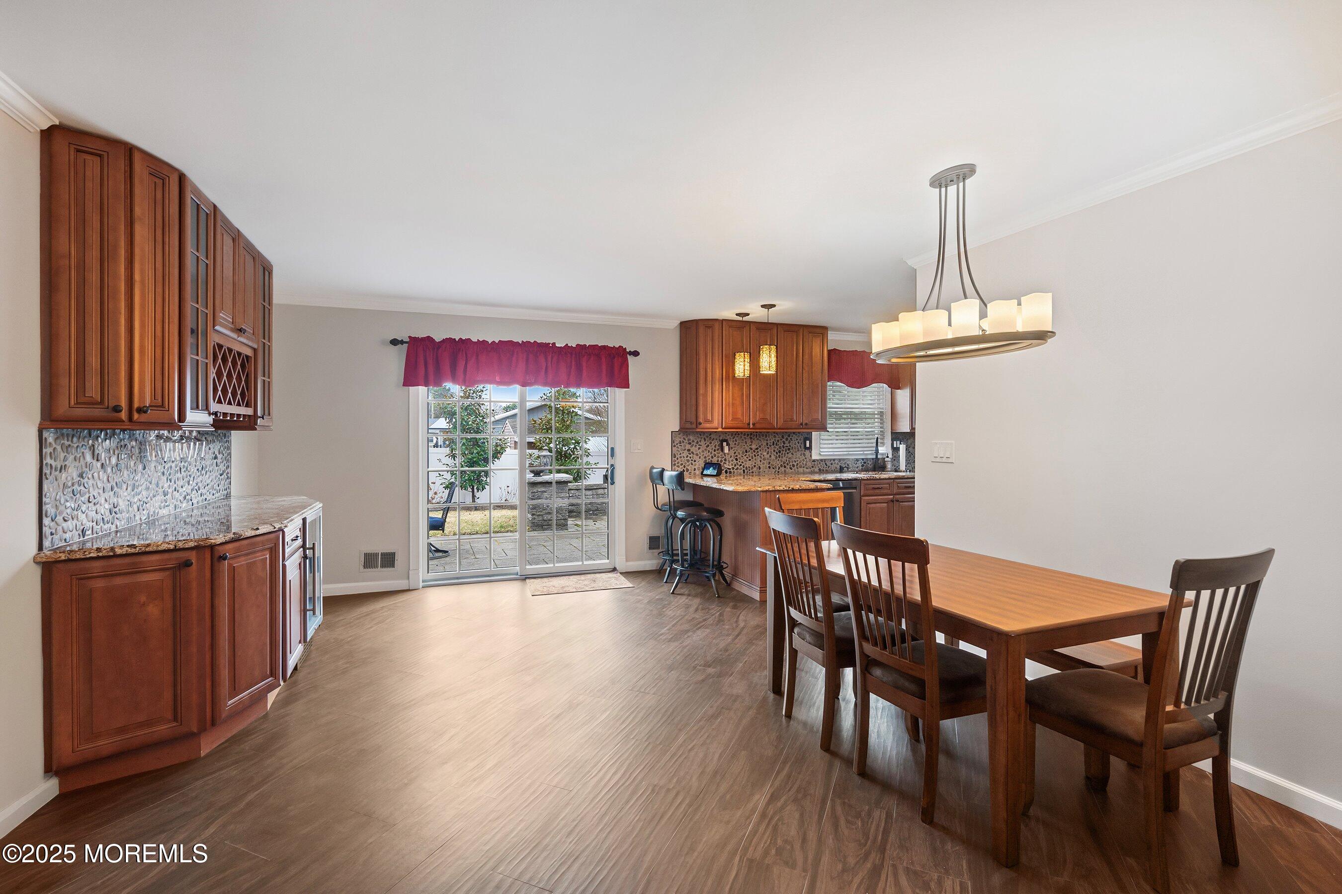29 Pine Needle Street Howell, NJ 07731 - Photo 7 of 26 a view of a dining room with furniture window and wooden floor