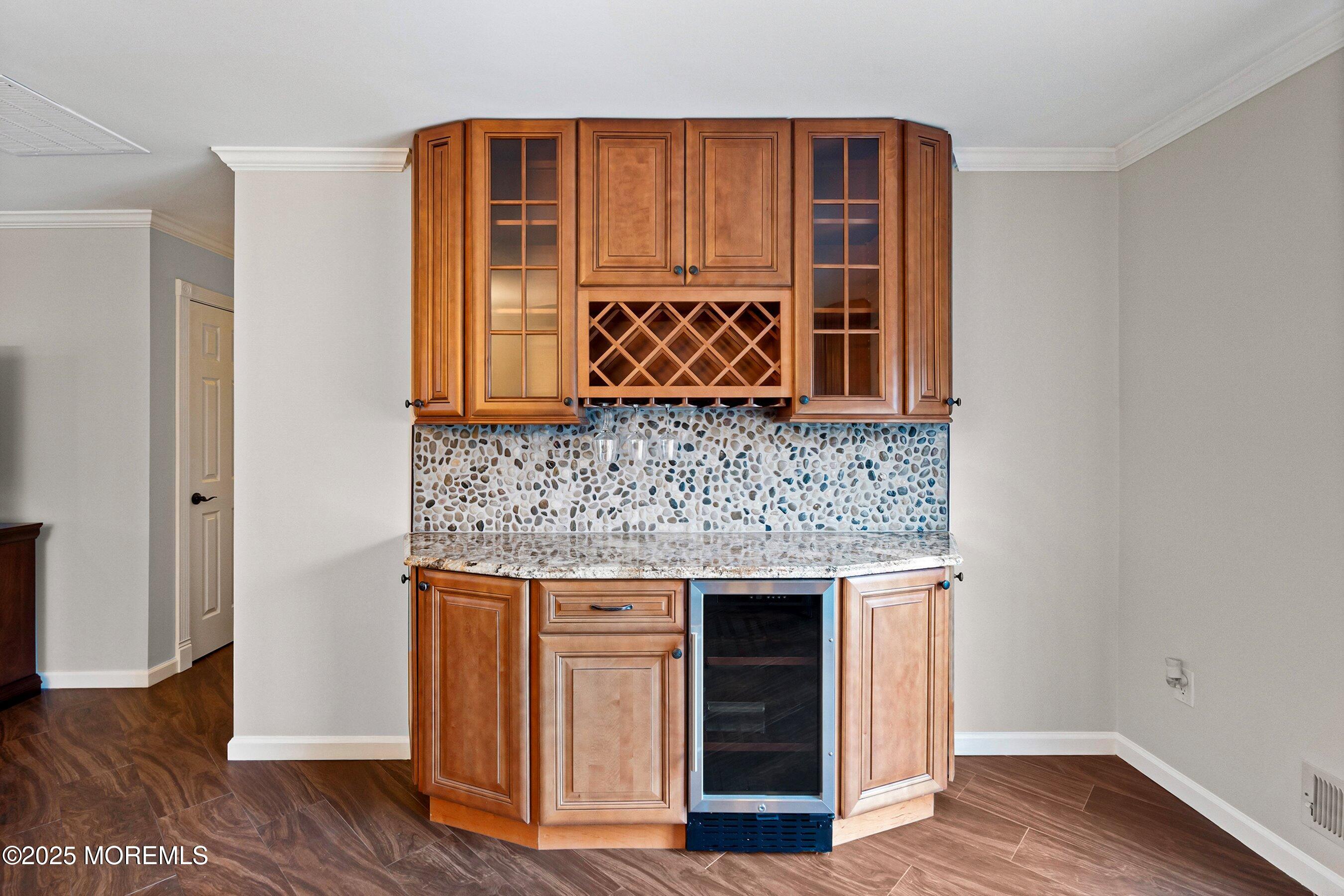 29 Pine Needle Street Howell, NJ 07731 - Photo 8 of 26 a kitchen with granite countertop a sink and a granite counter tops