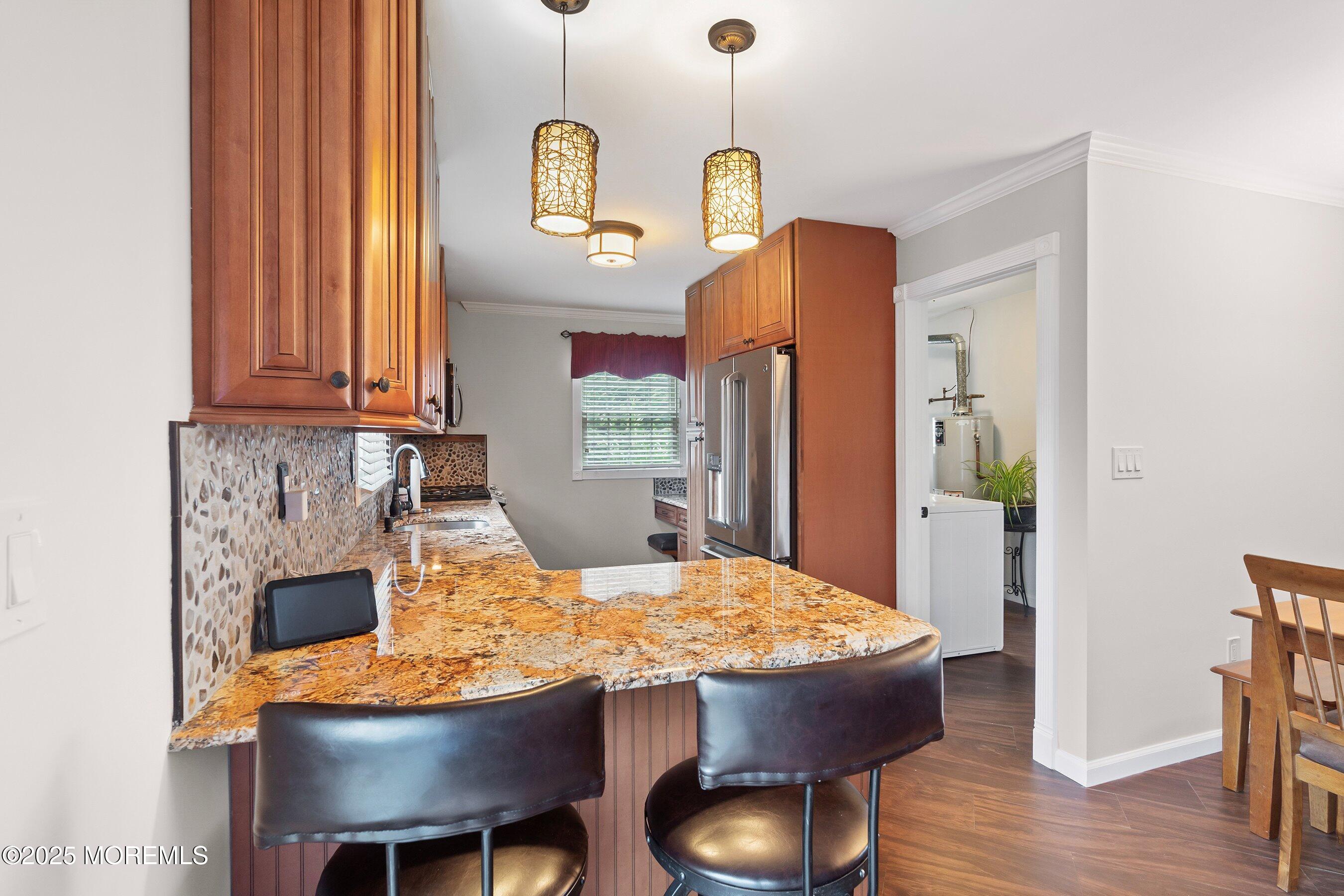 29 Pine Needle Street Howell, NJ 07731 - Photo 9 of 26 a view of a dining room with furniture and wooden floor