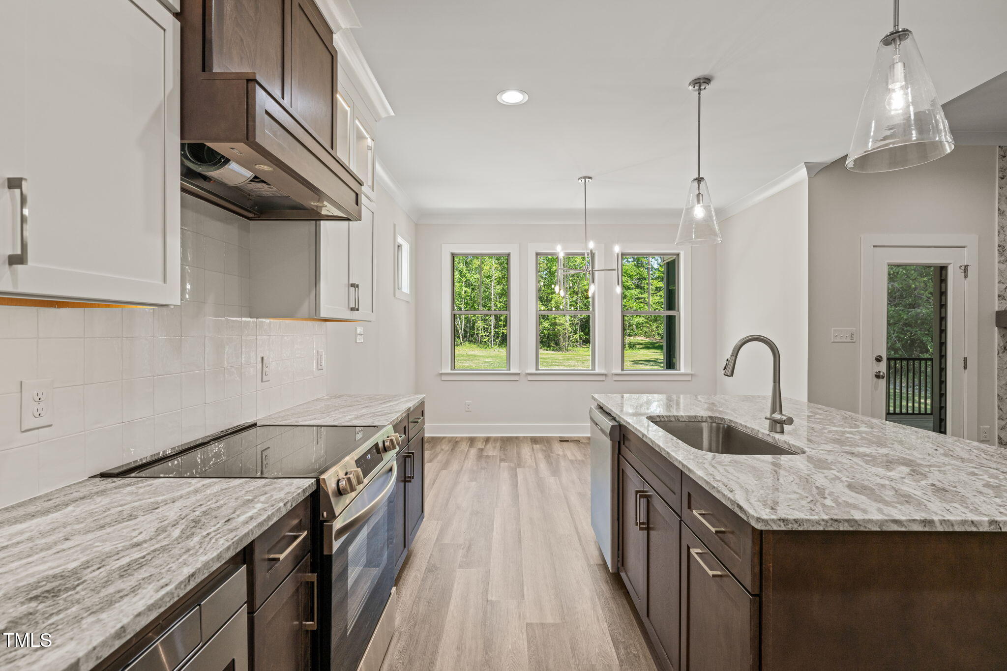 310 Pilot Ridge Road Zebulon, NC 27597 - Photo 13 of 46 a kitchen with granite countertop a sink a counter space appliances and cabinets