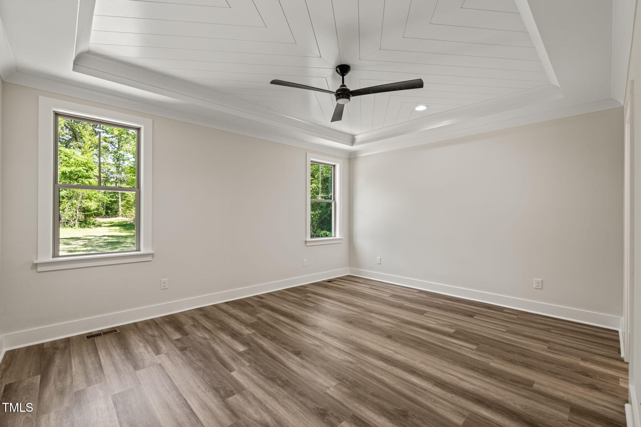 310 Pilot Ridge Road Zebulon, NC 27597 - Photo 19 of 46 wooden floor in an empty room with a window