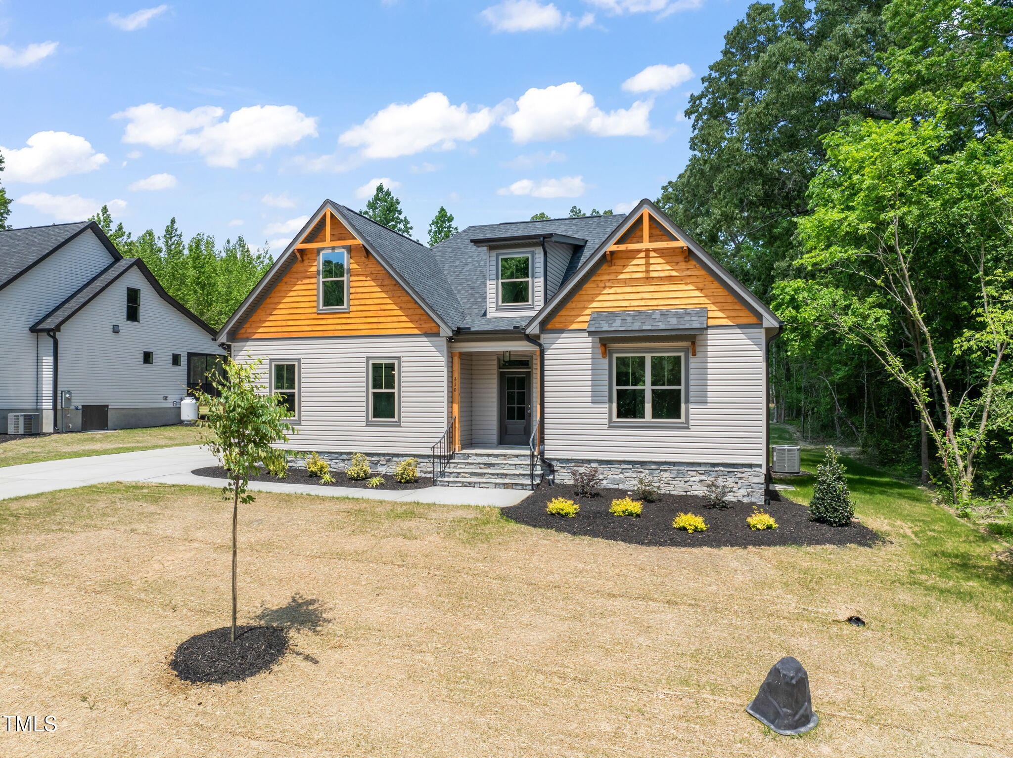 310 Pilot Ridge Road Zebulon, NC 27597 - Photo 2 of 46 a front view of a house with a yard