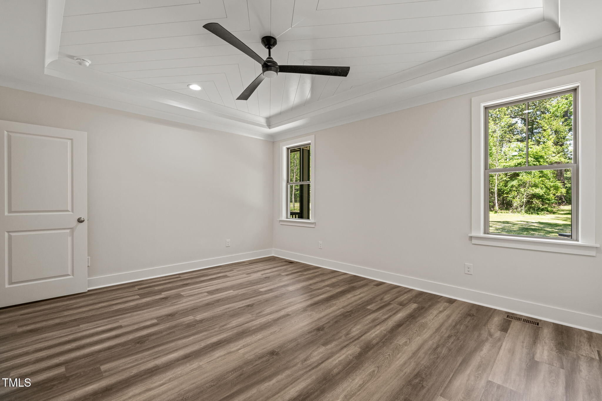 310 Pilot Ridge Road Zebulon, NC 27597 - Photo 21 of 46 a view of empty room with wooden floor and fan