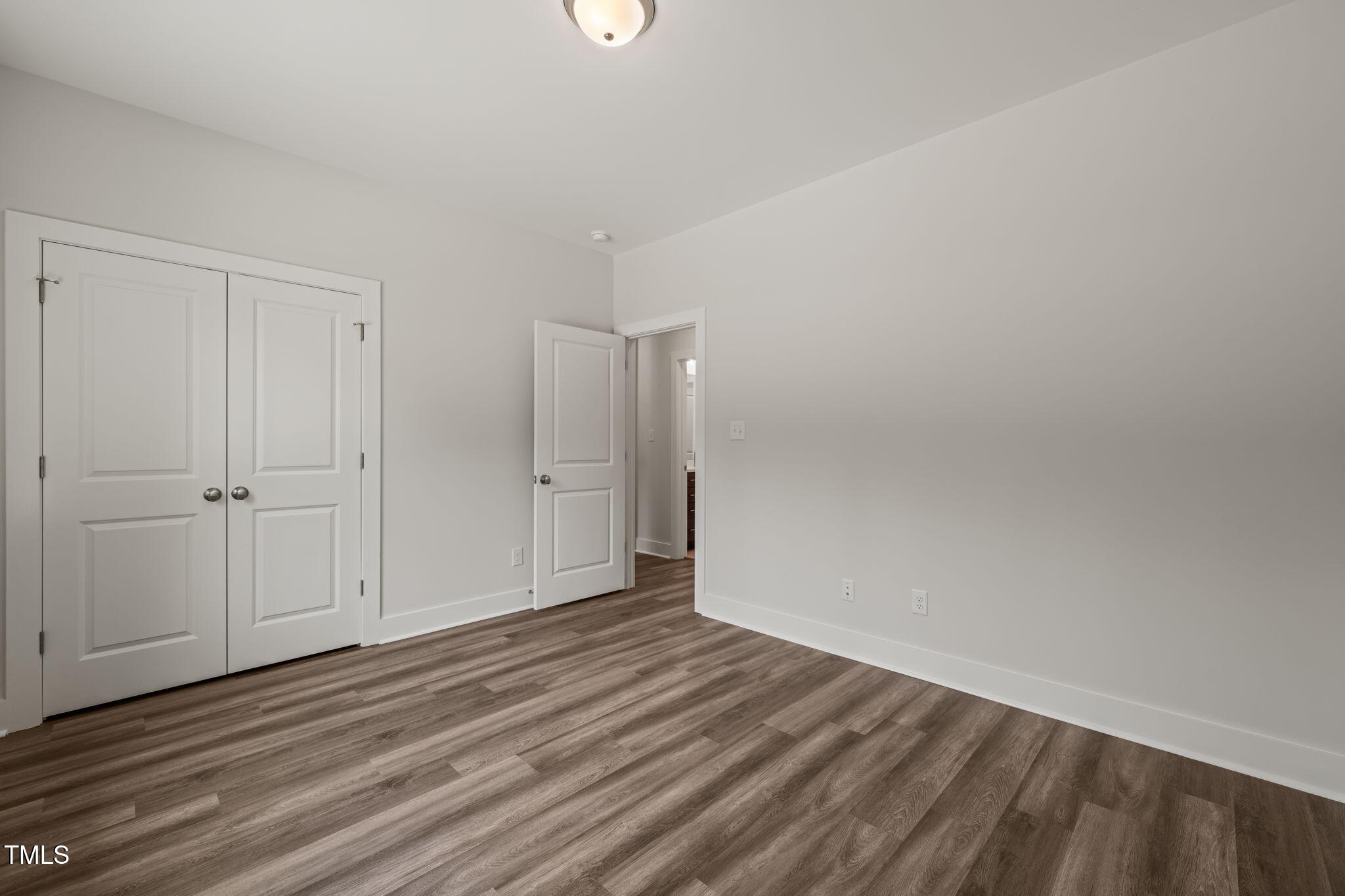 310 Pilot Ridge Road Zebulon, NC 27597 - Photo 26 of 46 a view of an empty room and wooden floor