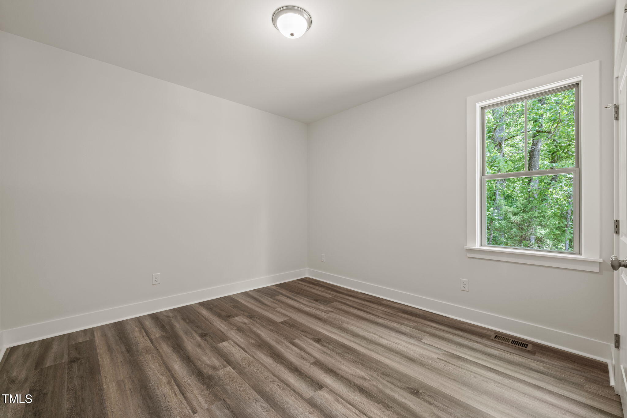 310 Pilot Ridge Road Zebulon, NC 27597 - Photo 27 of 46 an empty room with a window