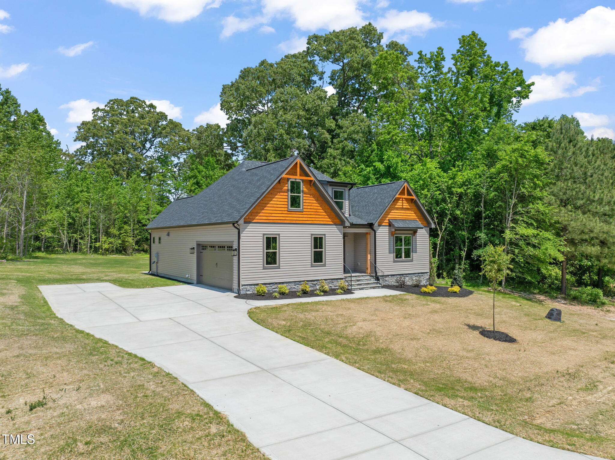 310 Pilot Ridge Road Zebulon, NC 27597 - Photo 46 of 46 a house with trees in the background