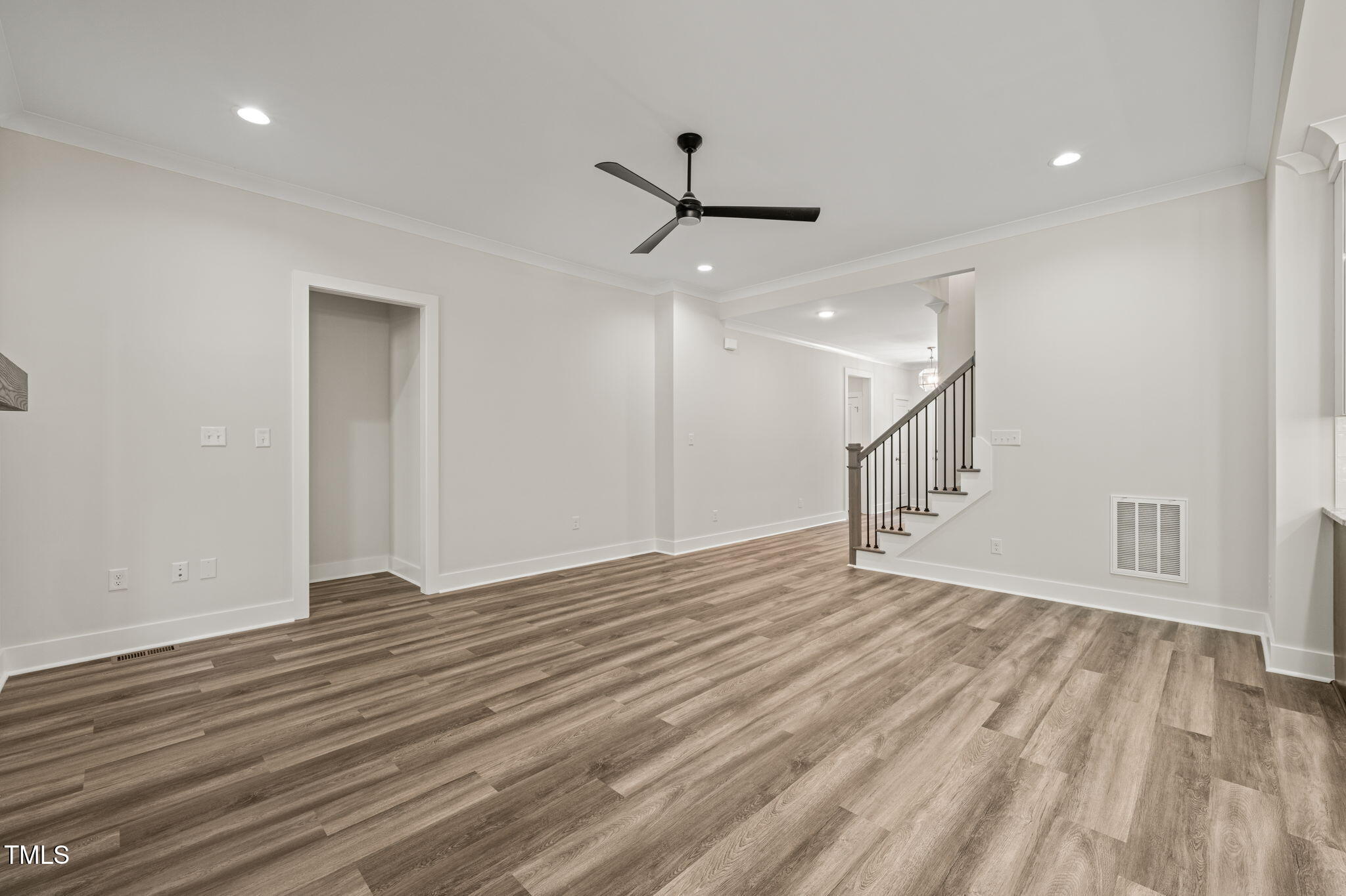 310 Pilot Ridge Road Zebulon, NC 27597 - Photo 9 of 46 a view of an empty room with wooden floor ceiling fan