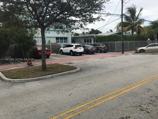 a view of street with parked cars